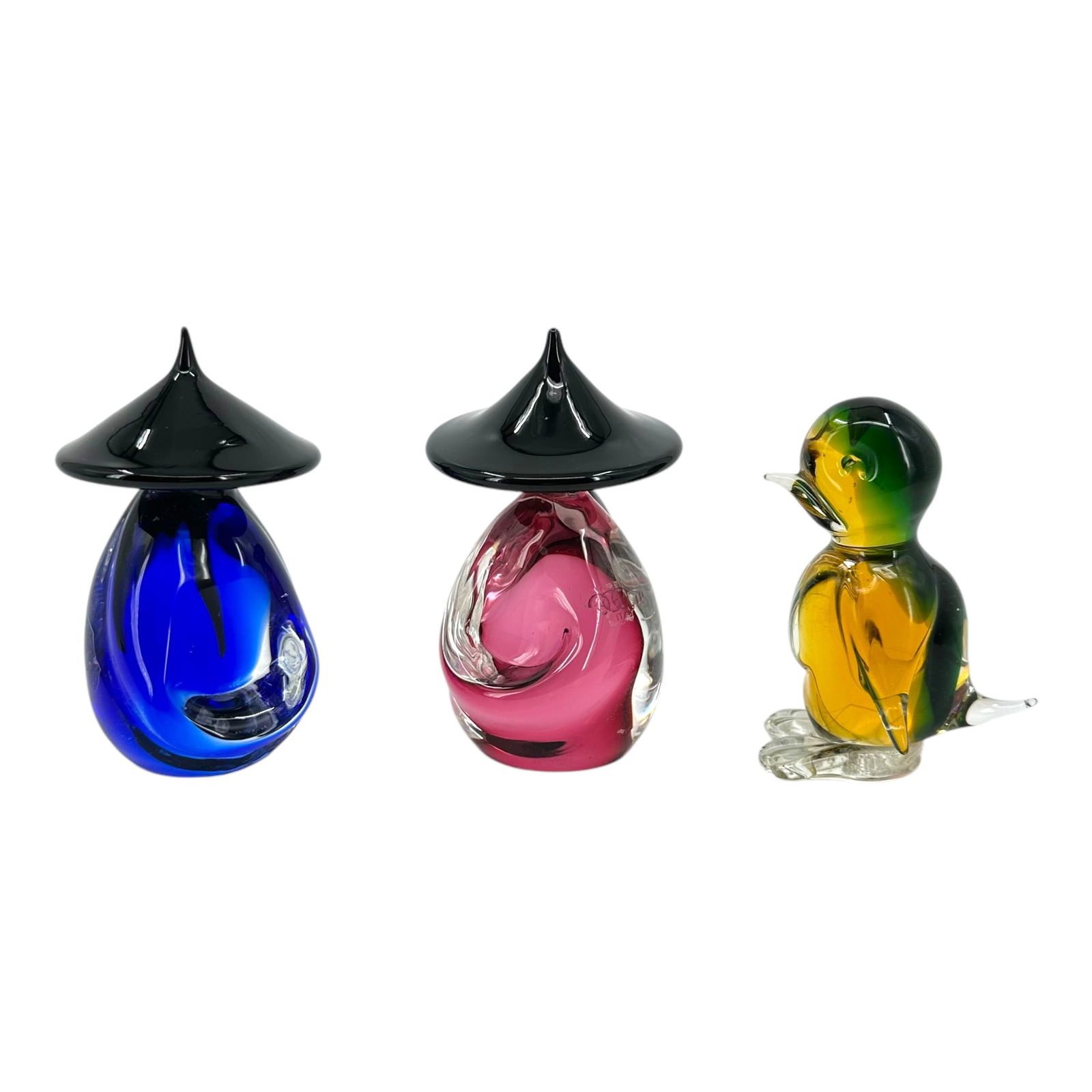 (Lot of 3) Italian Murano Art Glass Paperweights or Figures: Lot consisting of two stylized Orientalist figures in blue, and cranberry glass, together with a green and yellow glass bird, largest: 5"h Absence of a condition report does not indicate that thi