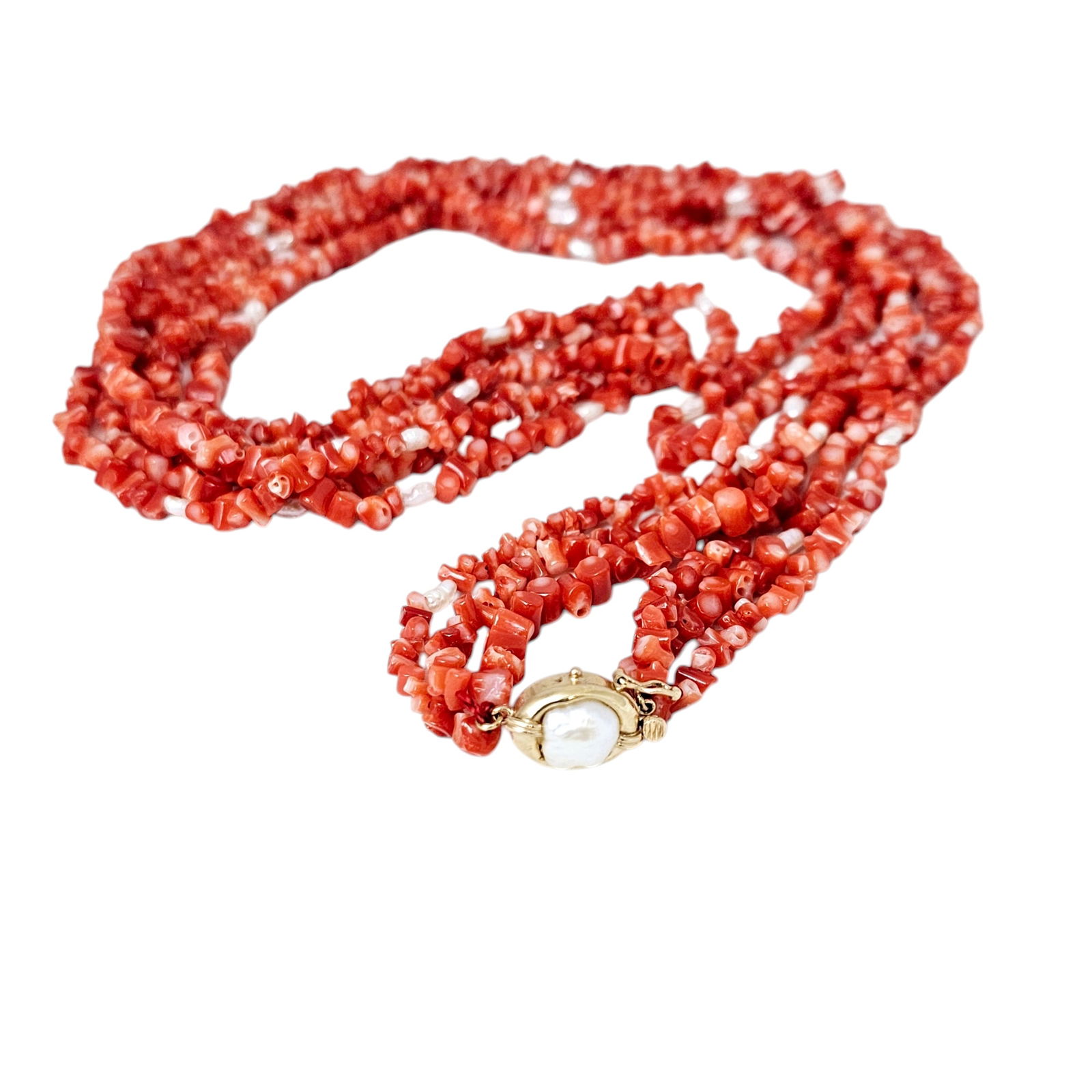 Coral, Freshwater Pearl, 14k Necklace: Composed of numerous branch coral beads interspaced by freshwater pearls, completed by a 14k yellow gold tongue-and-groove clasp with figure eight safety, enhanced by one baroque-shape freshwater pear