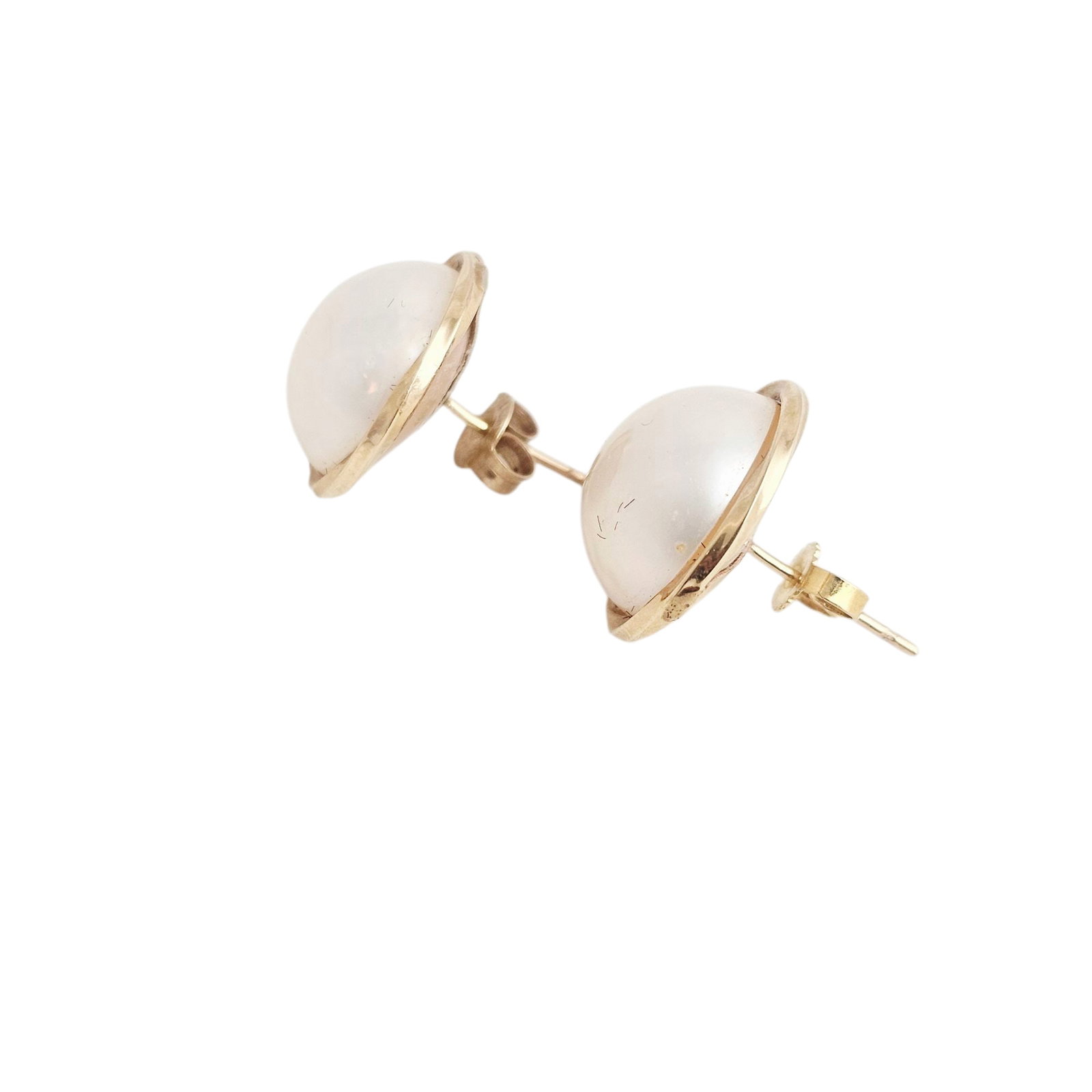 Pair of Mabe Cultured Pearl, 14k Yellow Gold Earrings: Each centering a round mabe cultured pearl measuring approximately 14.0 mm, set in a 14k yellow gold earring mounting. Gross weight: 5.6 grams. Absence of a condition report does not indicate tha