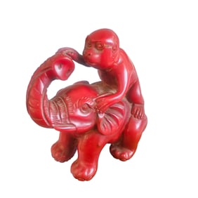 A Carved Coral Figural Group of an Elephant and a Monkey