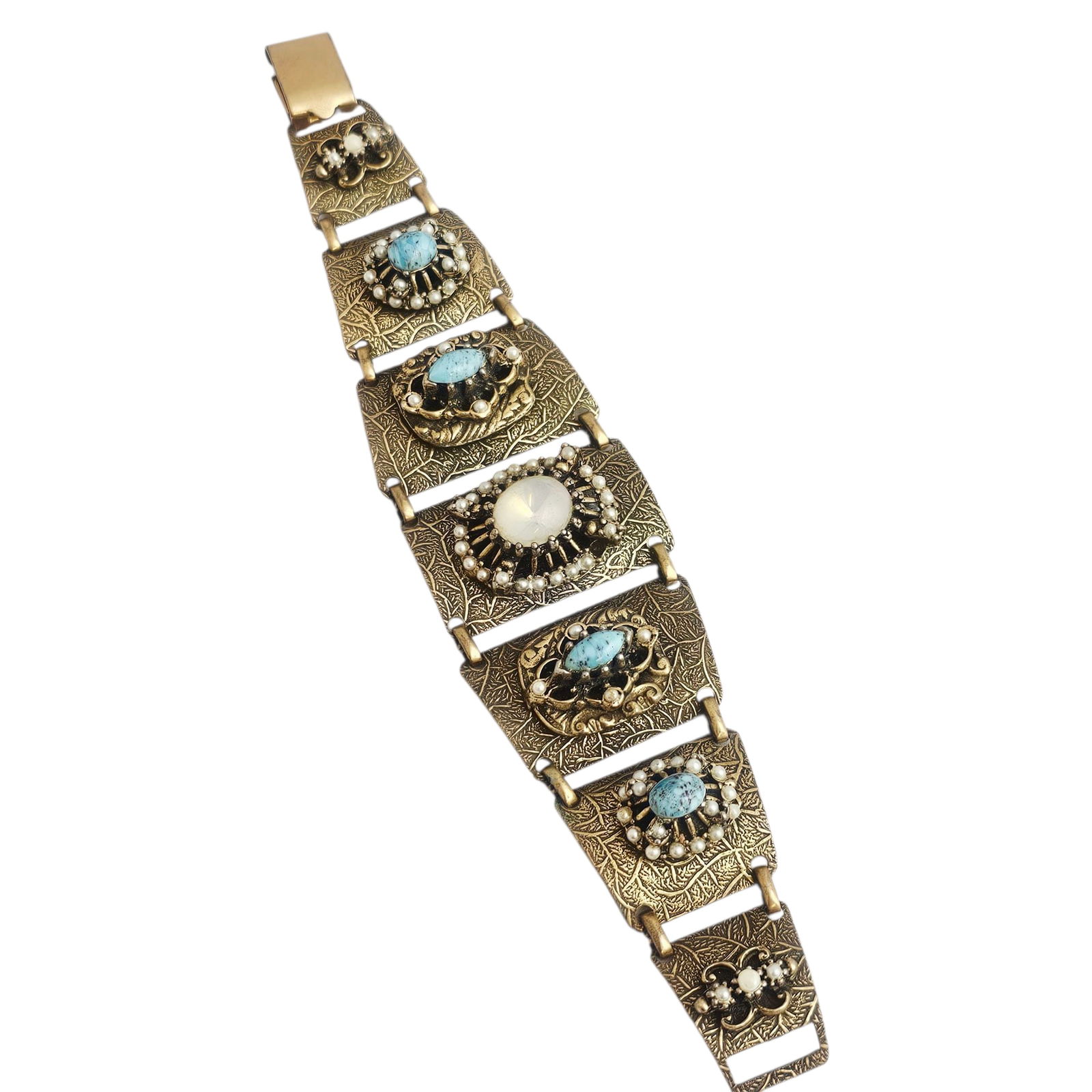 Vintage Brass Linked Fashion Cuff Bracelet: Textured brass with filigree and detailed mounts, with blue and white faux stones and pearl-like beads. Absence of a condition report does not indicate that this lot is in perfect condition. Ple