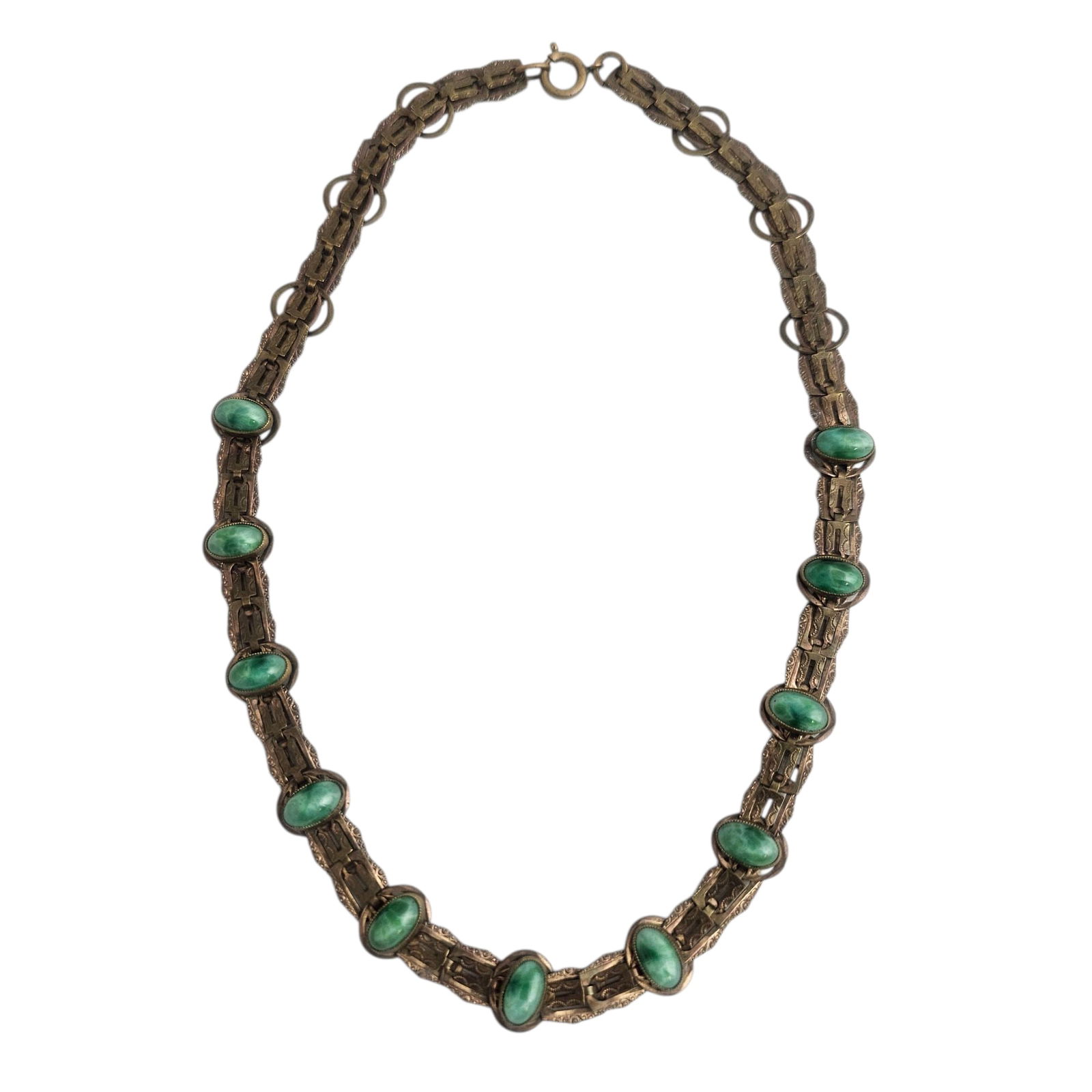 Art Deco Necklace with Satin Green Glass Accents: Worn gold-filled metal with stamped design with various shaped linked, with 11 bead cabochons of satin green glass. Absence of a condition report does not indicate that this lot is in perfe