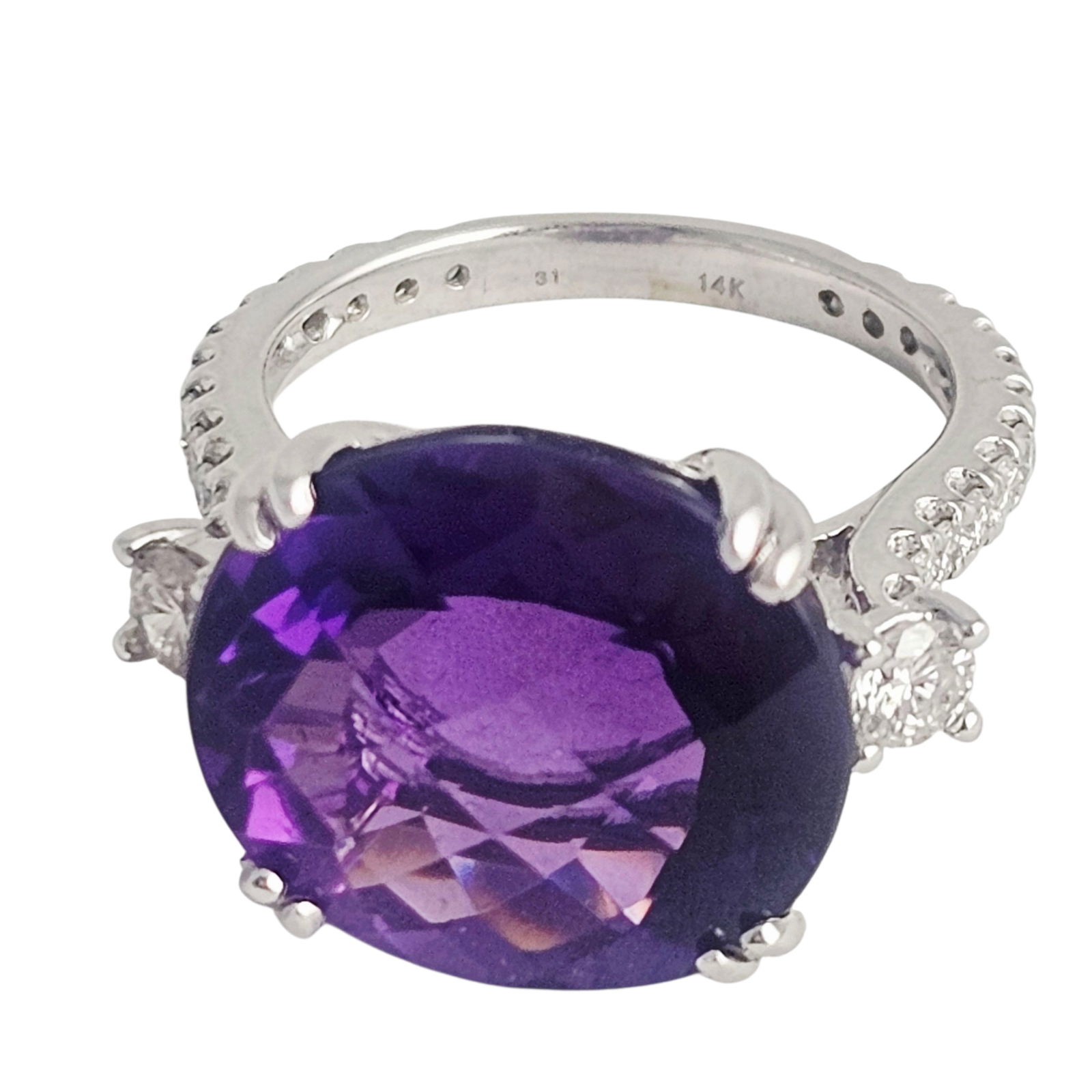 Amethyst, Diamond, 14k White Gold Dress Ring: Featuring an oval, checkerboard-cut amethyst weighing approximately 12.97 cts., accented by twenty-six round brilliant-cut diamonds weighing a total of approximately 0.78 cttw., set in a 14k white gol
