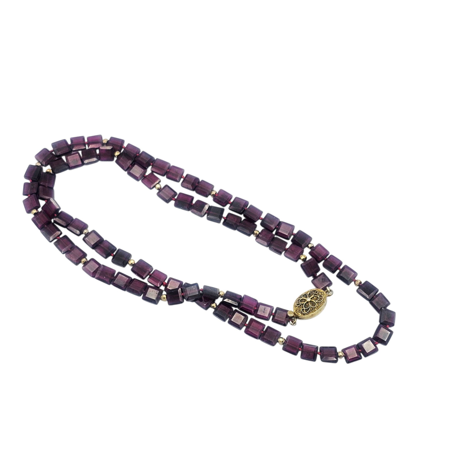 Rhodolite Garnet, Vermeil Necklace: Composed of eighty-three square rhodolite garnet beads, interspaced by faceted vermeil beads and completed by a vermeil tongue-and-groove clasp forming a 24 inch necklace. Gross weight: 31.4 grams.