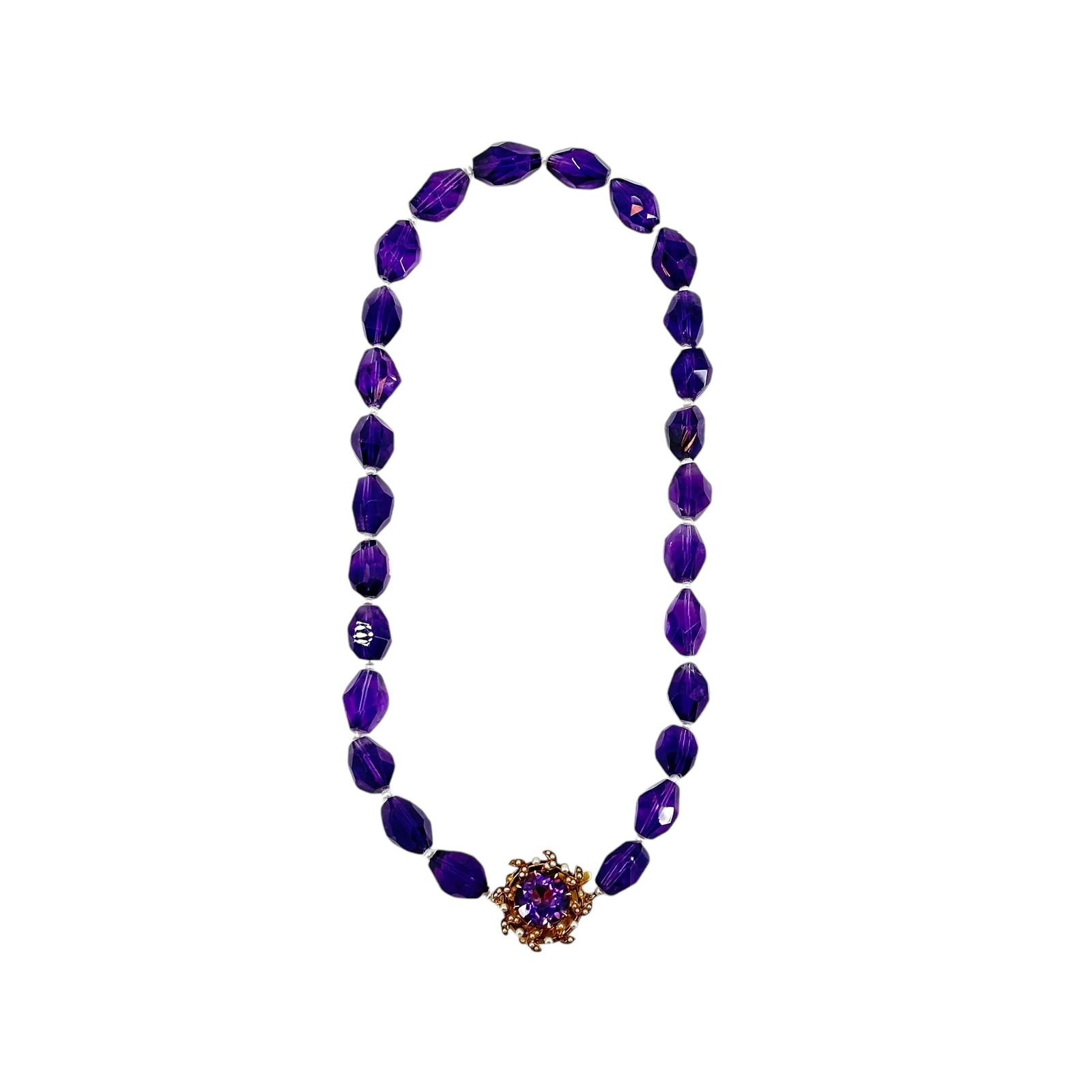 Amethyst, Seed Pearl, and 14k Necklace: Amethyst, seed pearl, and 14k necklace, comprising of 26 faceted beads spaced by a seed pearl. Closure is 14k gold with seed pearl and amethyst center stone. Necklace measures 16 in L. Condition is go
