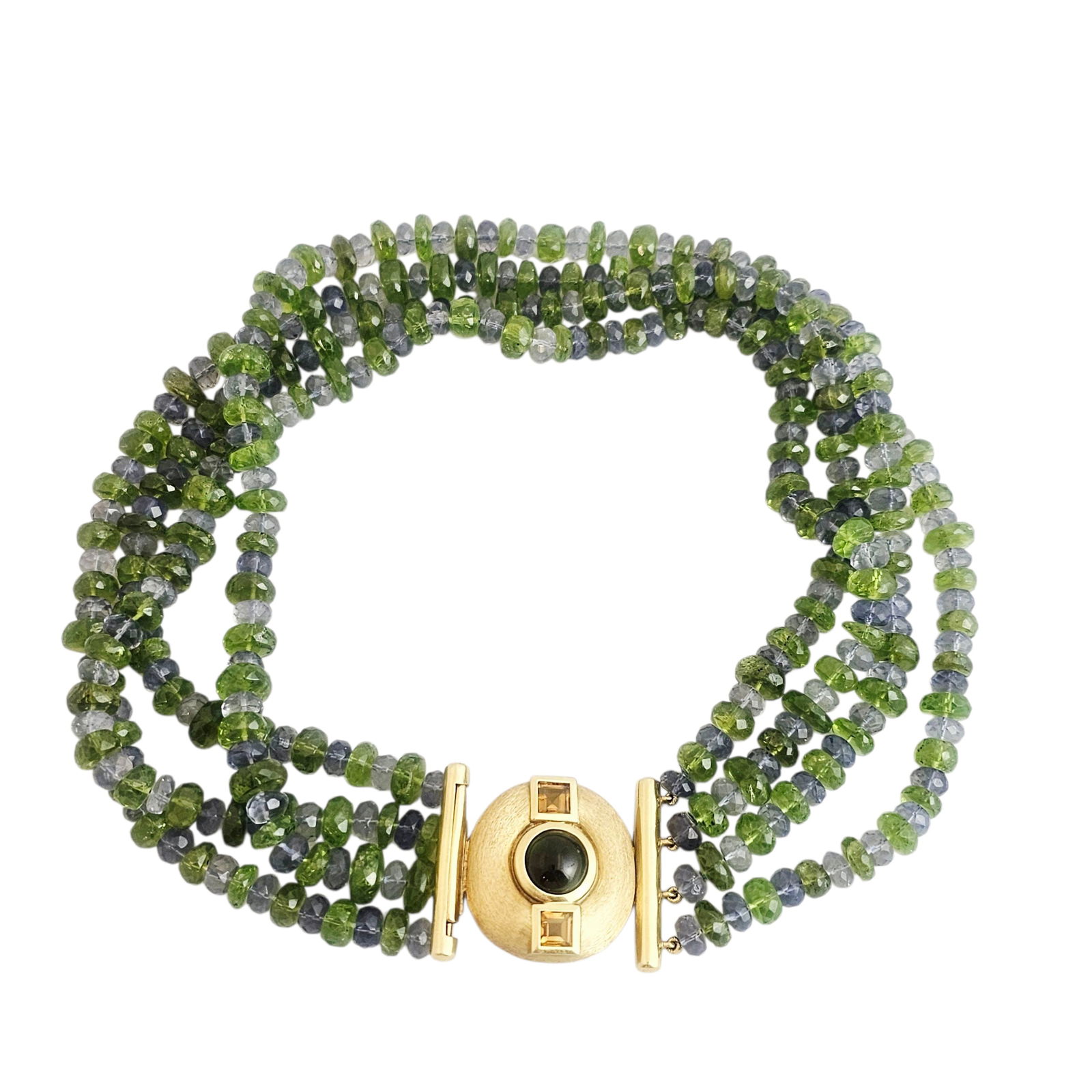 Multi-Stone, 18k Yellow Gold Necklace: Composed of alternating, faceted peridot and iolite beads terminating to an 18k yellow gold clasp centering one green tourmaline cabochon measuring approximately 10.0 mm, flanked by two square st