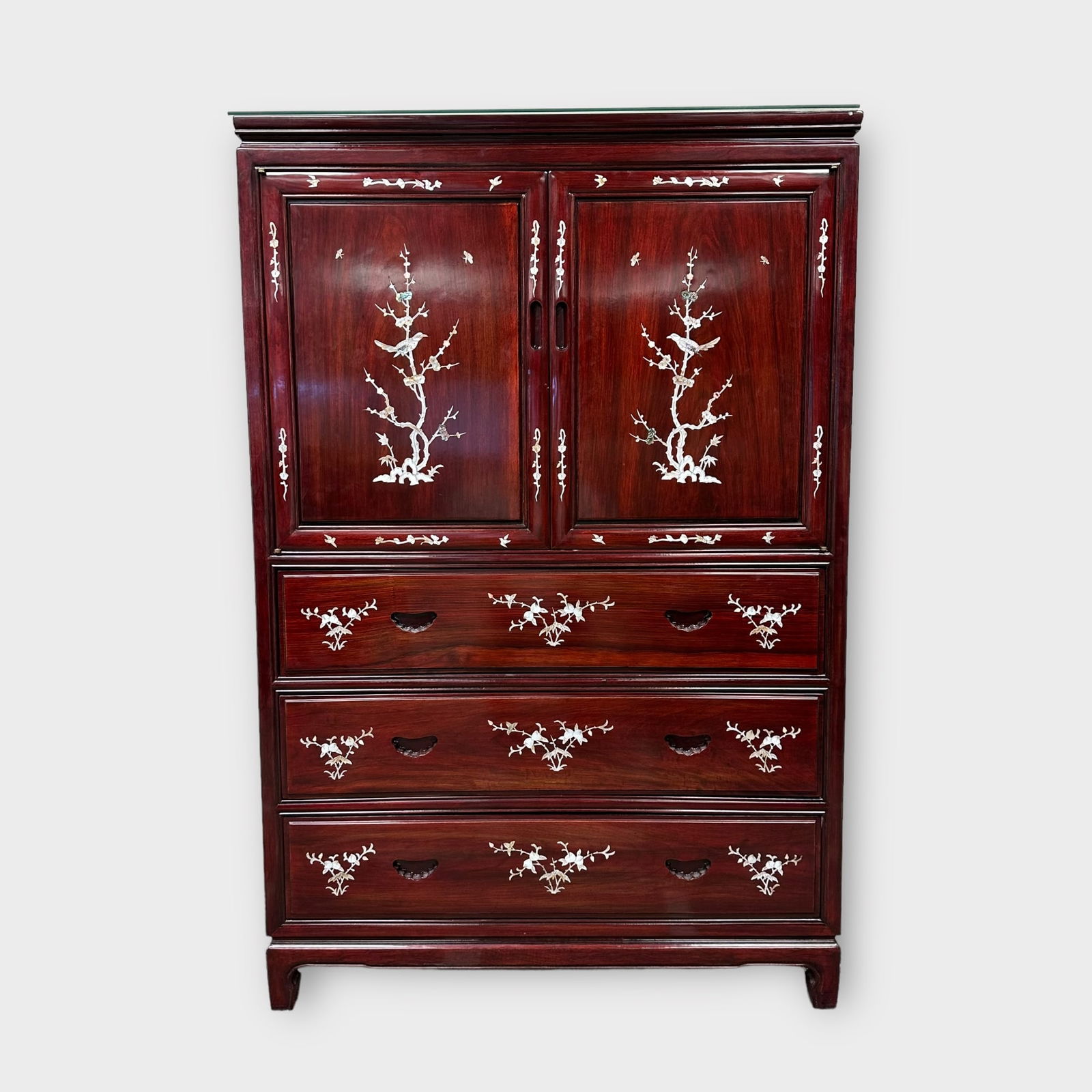 Two Door Rosewood and Mother of Pearl Inlay Cabinet: Two door rosewood and mother of pearl inlay Asian cabinet with three drawers below. Glass panel on top. Measures approximately 39 1/2 in W x 17 1/2 in D x 60 in H. Condition is good, minor scratc