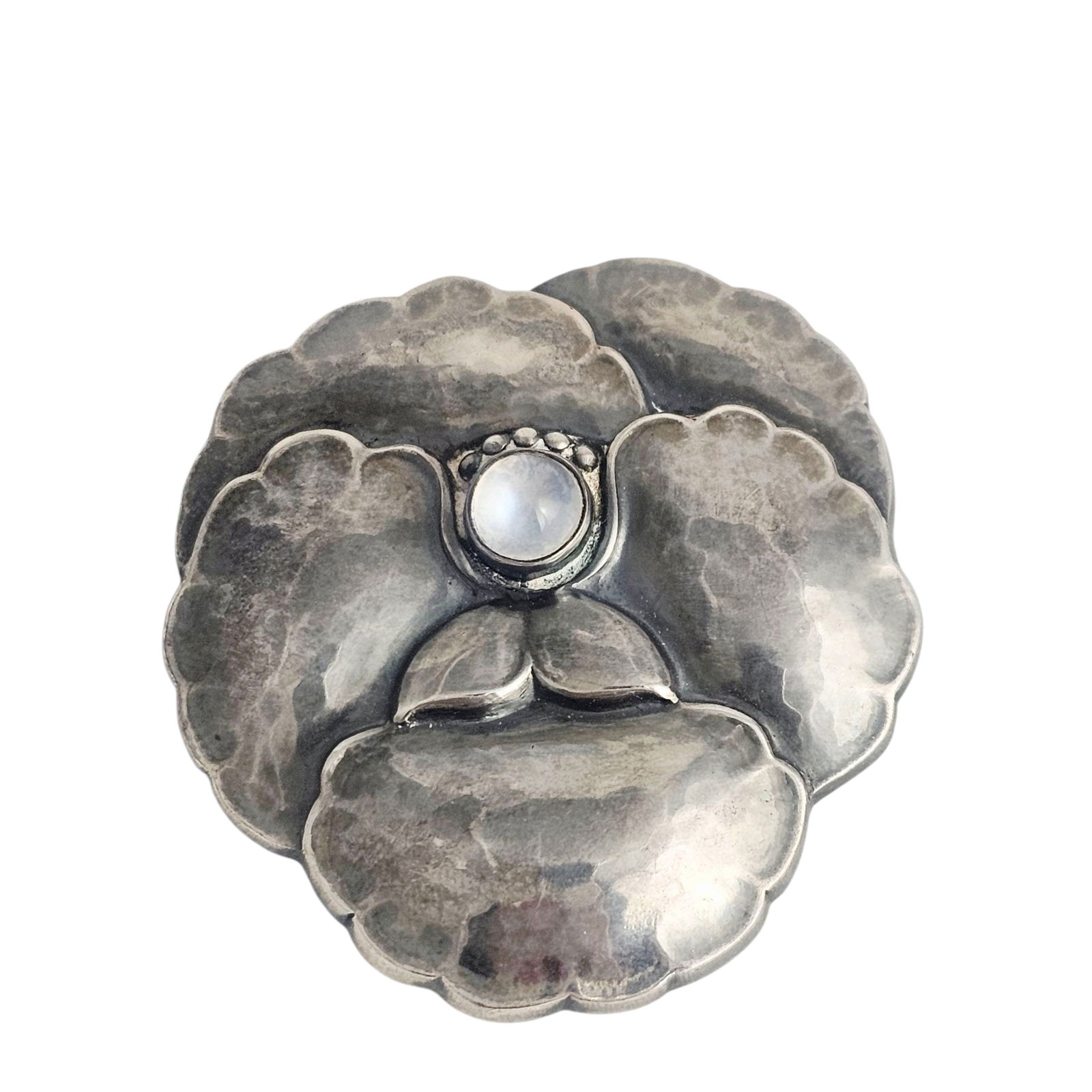 Moonstone, Sterling Pansy Pin, Georg Jensen: Designed as a pansy centering one round moonstone cabochon, set in a sterling silver pin mounting measuring approximately 1.60 x 1.58 inches. Marked: "925 S, Denmark, Georg Jensen, 113." Gro