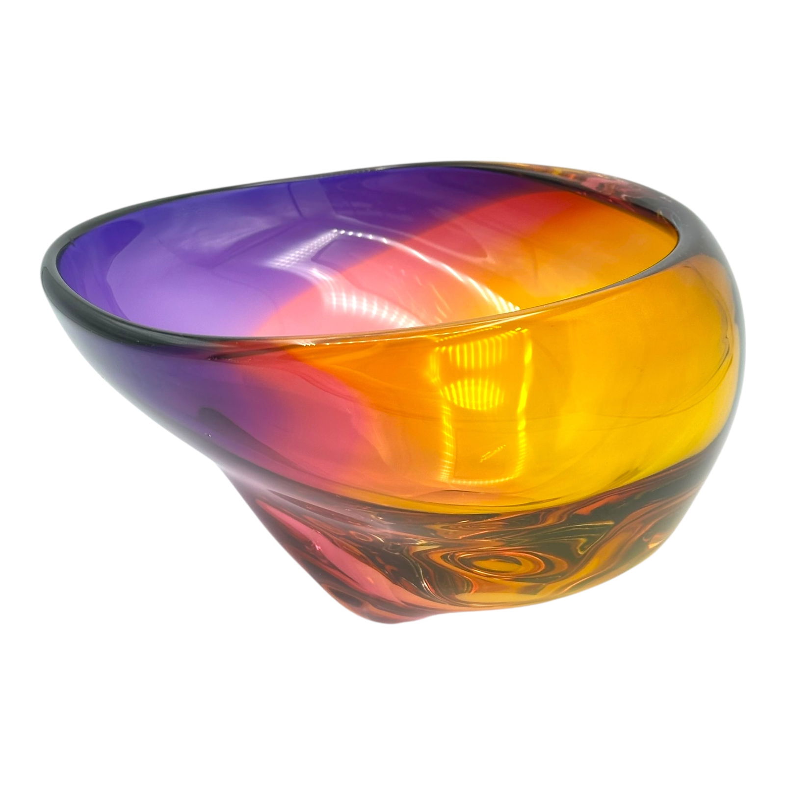 Michelle Kaptur Art Glass Bowl: A Michelle Kaptur art glass bowl in a vibrant colorway ranging from orange to purple in an abstract form. Signed "Kaptur" at the bottom. Condition is very good.