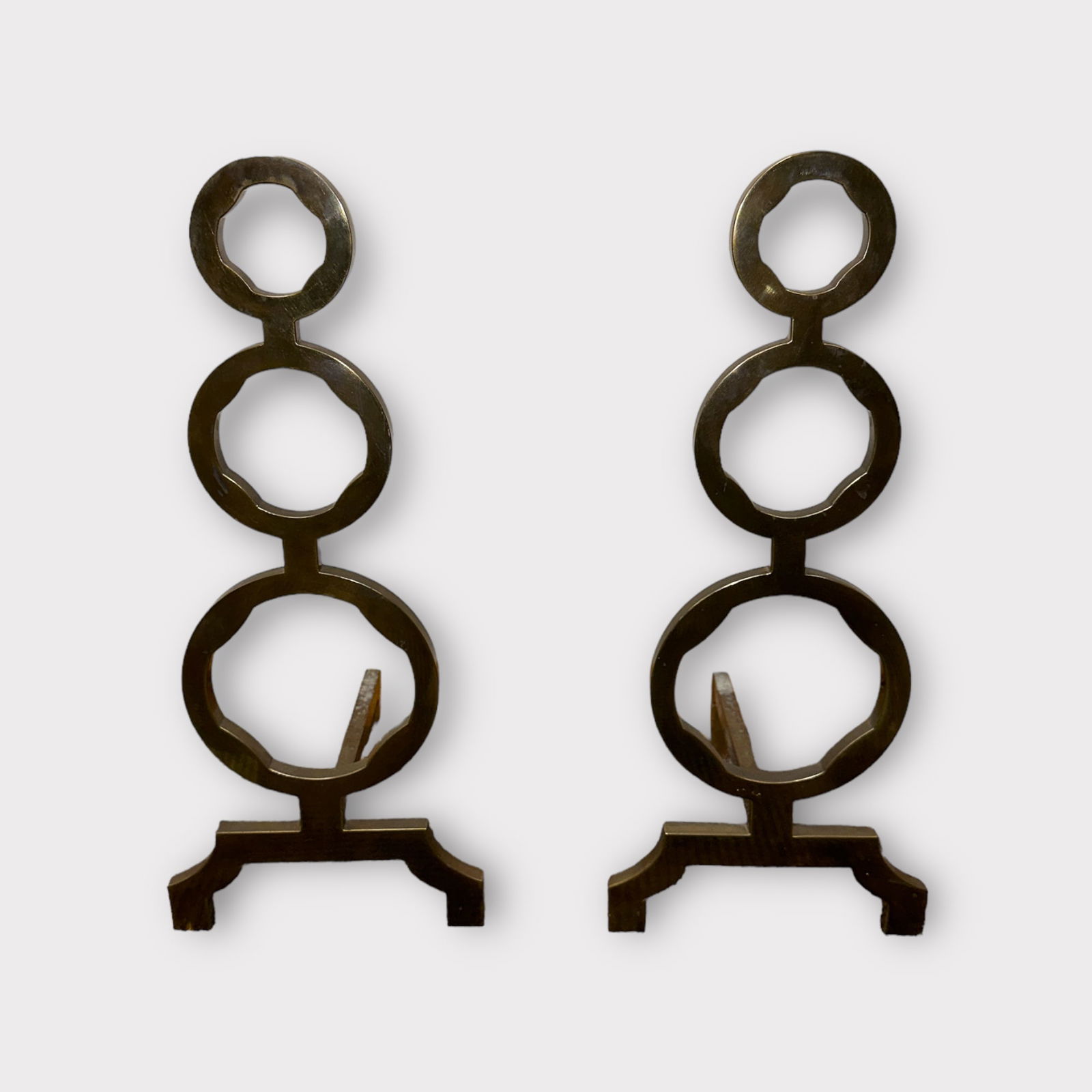 Set of Circular Brass Andirons: Pair of brass circular andirons. Measurements approximately: 9 1/2 in L x 8 in W x 19 in H. Condition is good.