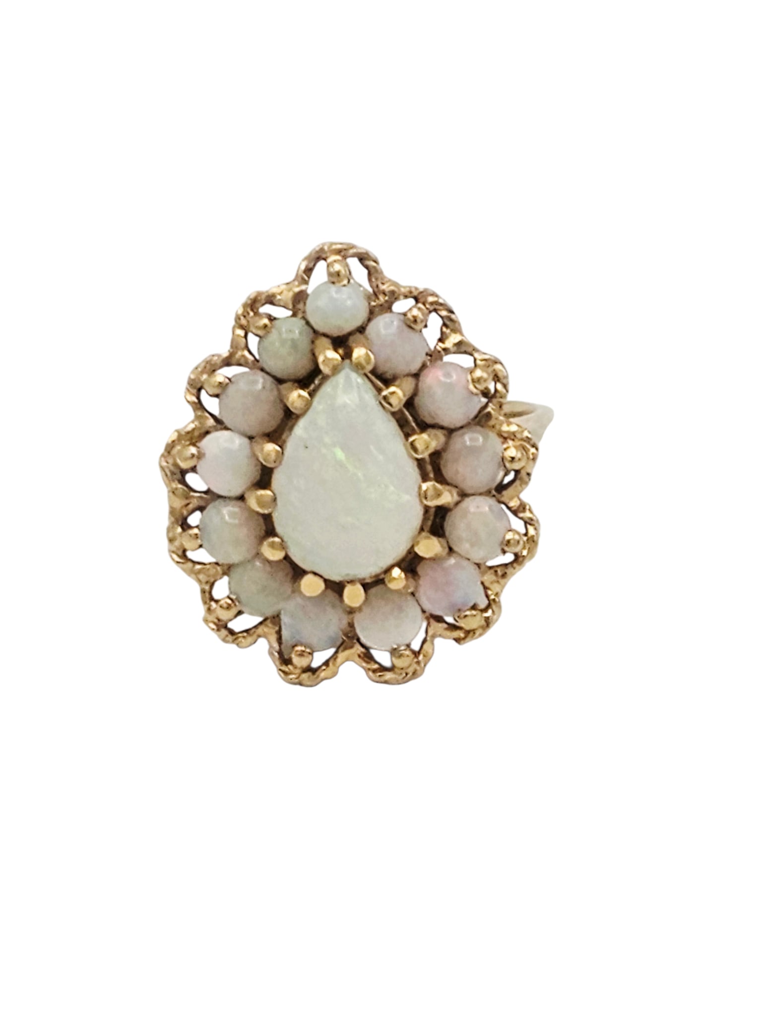 Opal, 14k Yellow Gold Ring: Centering a pear-shape opal cabochon measuring approximately 10.0 x 7.0 mm, framed by thirteen round opal cabochons, set in a 14k yellow gold ring mounting, size 5 1/4. Gross weight: 6.5 grams.