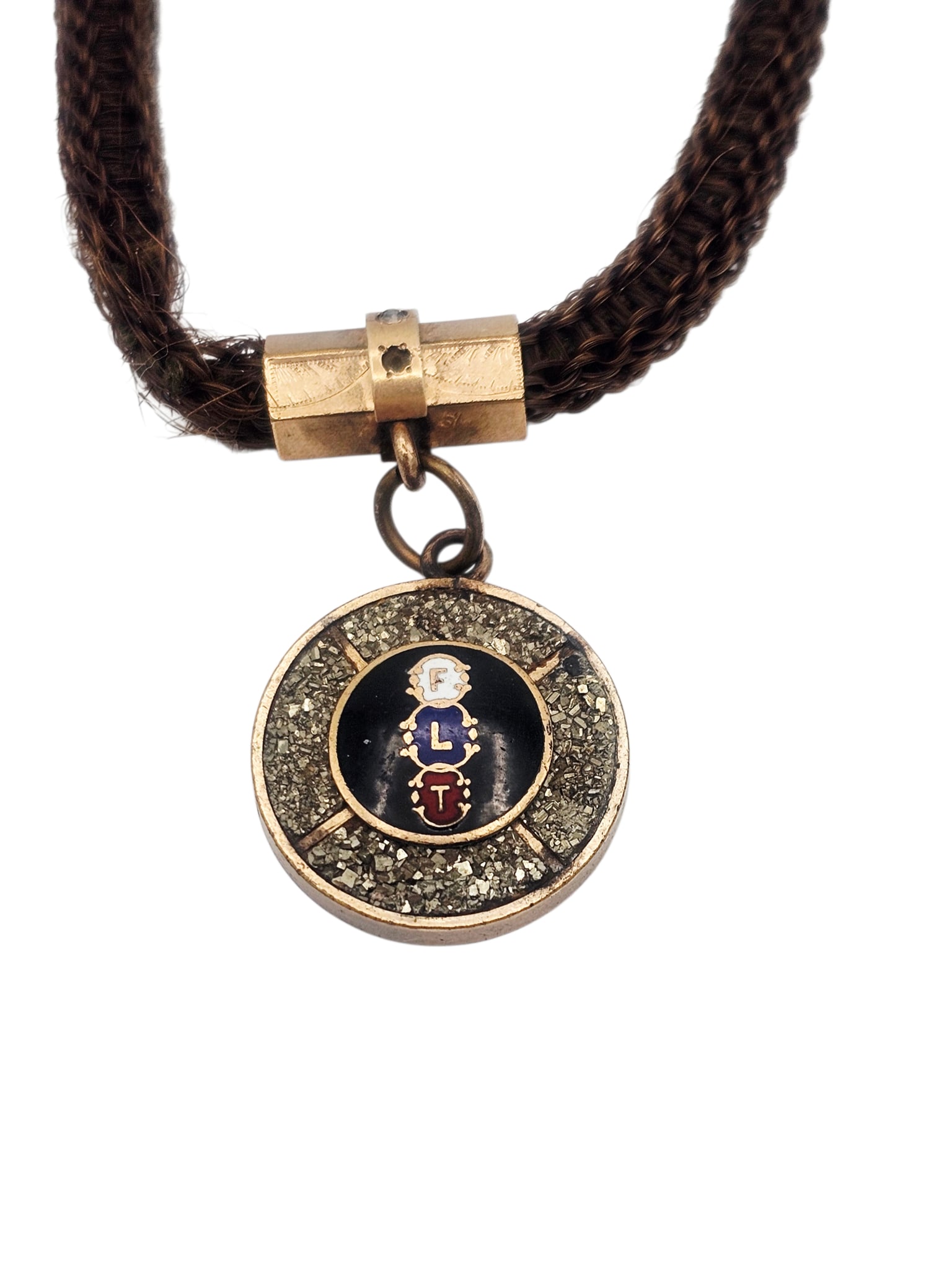 Victorian Gold-Filled Hairwork Watch Chain with Oddfellow Fob: Featuring a circular fob centering enamel letters 'FLT" encircled by inlaid pyrite, measuring approximately 0.80 inches, suspended by a woven hairwork watch chain completed by a ros