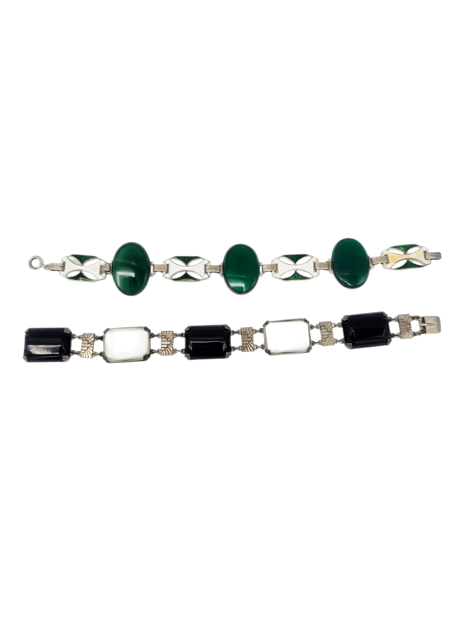 Two Art Deco Hardstone, Enamel, Sterling Silver Bracelets: Including one bracelet featuring three oval green agate cabochons interspaced by white and green guilloche enamel links, set in a sterling silver mounting, 7 1/2 inches; together on bracelet designed