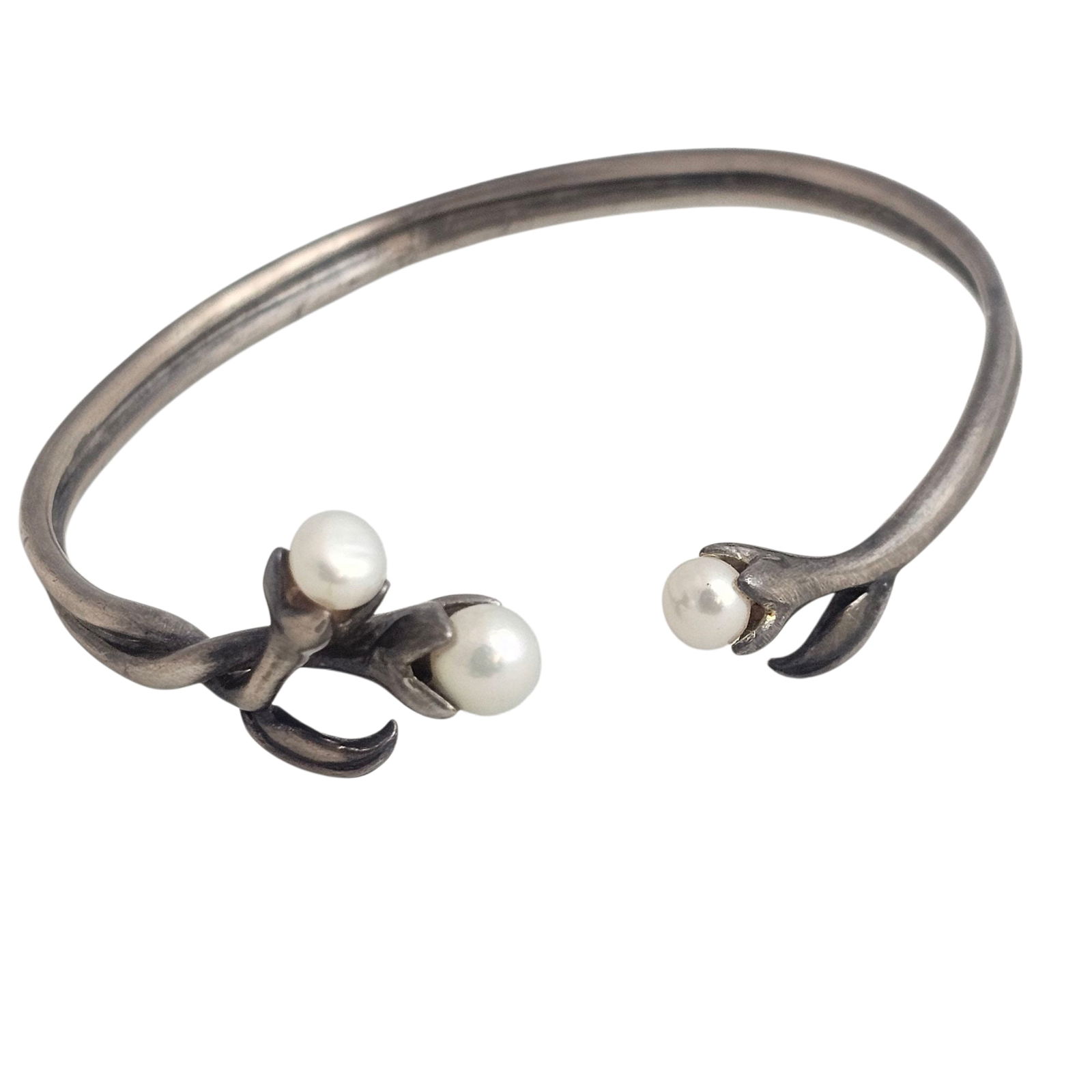 Signed Pearl & Sterling Leaf & Flower 'Bud' Bracelet:  Indistinctly signed, three pearls with formed leaves. Total gram weight 16.1 grams. Absence of a condition report does not indicate that this lot is in perfect condition. Please request a condi