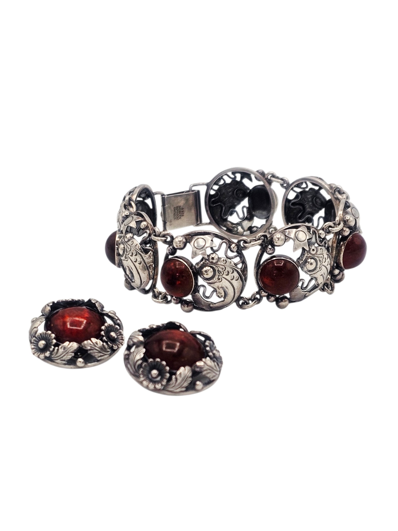 Mid-Century Danish Amber, Sterling Silver Jewelry Suite, N.E. From: Including a bracelet featuring seven round amber cabochons set in a fish motif, sterling silver articulated mounting completed by a locking clasp, 8 inches; together with a pair of near matching ear c