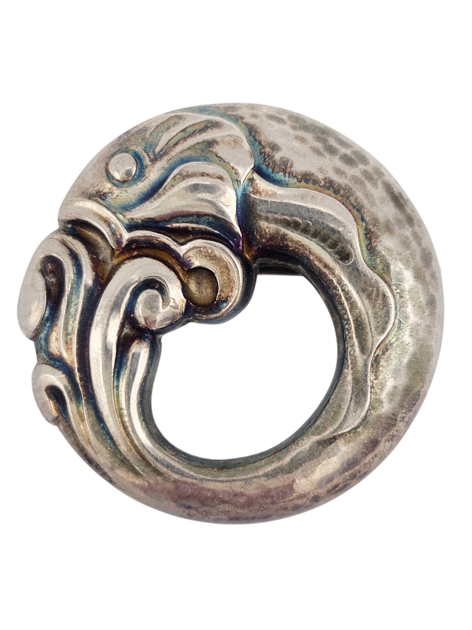 Georg Jensen Sterling Silver Fish Pin #10: The sterling silver circular pin designed as a fish, measuring approximately 1.25 inches in diameter. Marked: Georg Jensen within dotted oval, sterling, Denmark, 10. Gross weight: 6.7 grams.