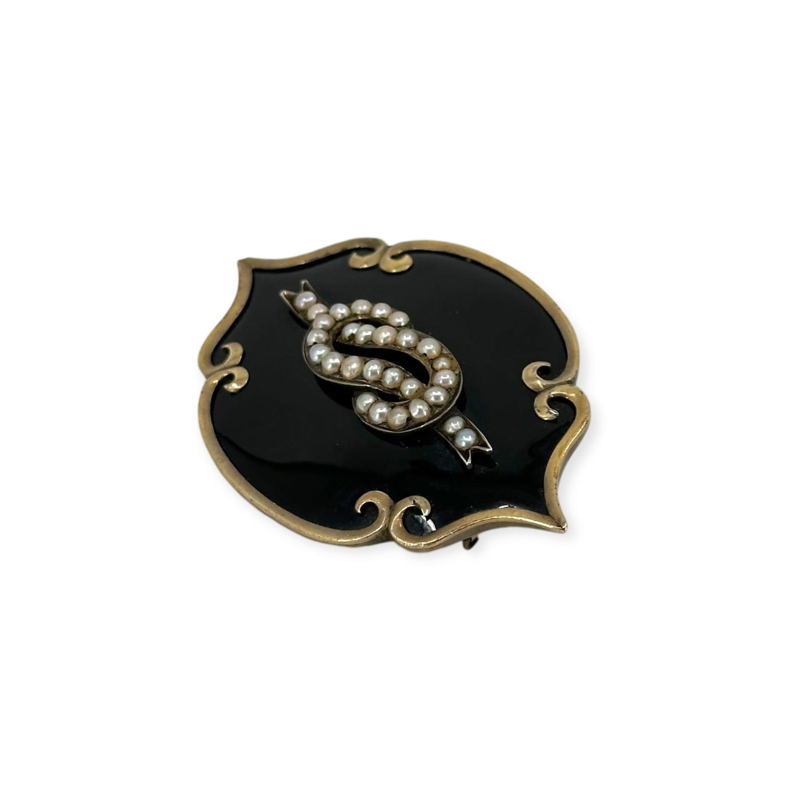Victorian Seed Pearl, Enamel, 10k Mourning Pin: Featuring a seed pearl lover's knot in a field of black enamel, reversing to braided hair under glass, set in a 10k yellow gold pin mounting measuring approximately 2.00 x 1.35 inches. Gross weigh