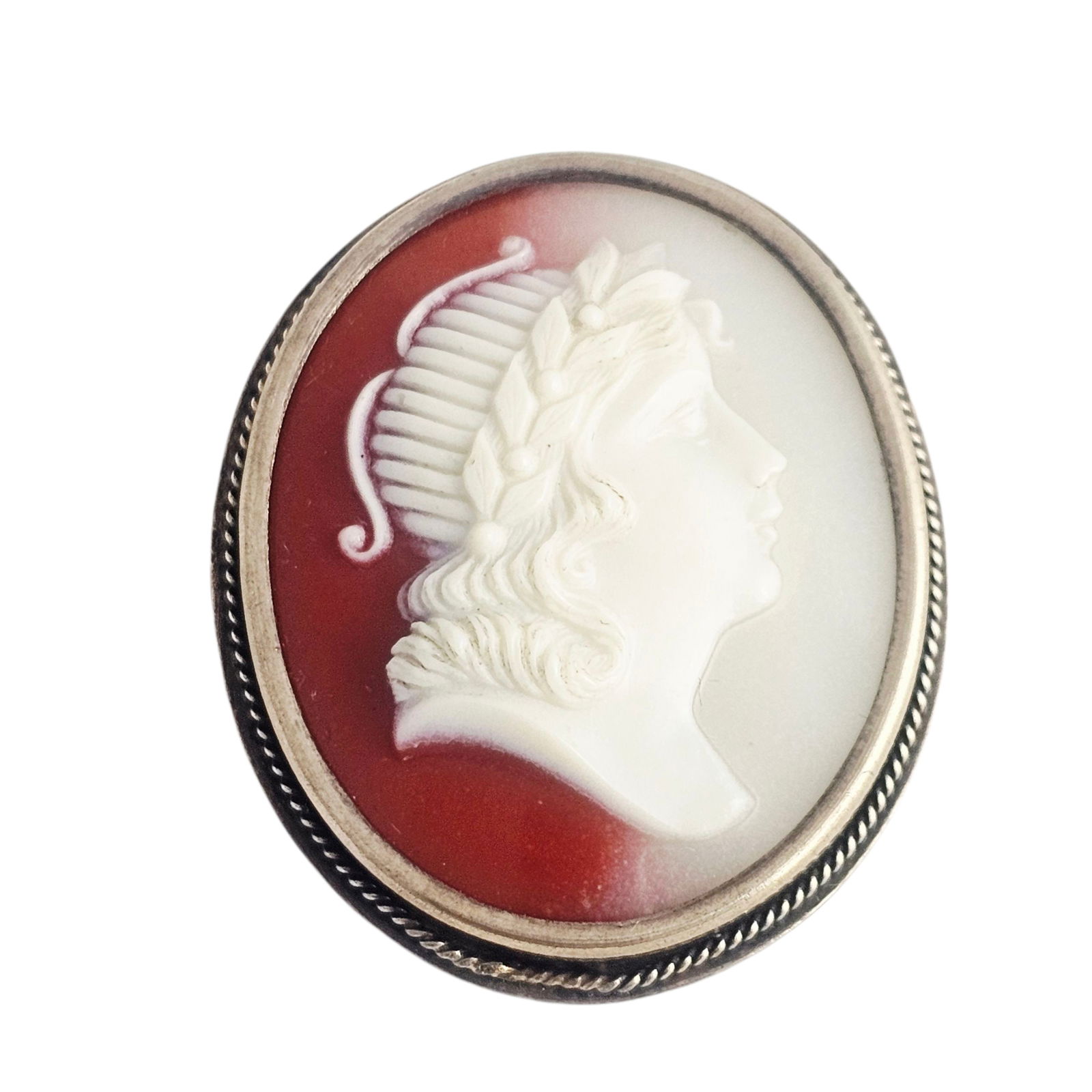 Soviet Russian Resin, Silver Cameo: Featuring an oval resin cameo depicting a classical face in profile, set in a silver pin mounting measuring approximately 1.65 x 1.40 inches. With Russian marks, Leningrad Jewelry Society, Leningrad,