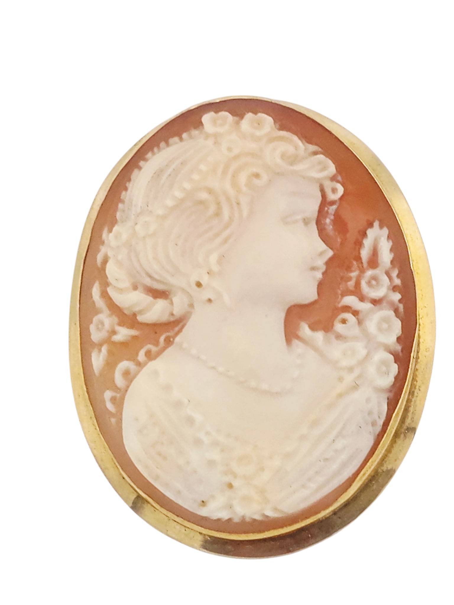 Shell Cameo, 18k Yellow Gold Pin Pendant: Featuring an oval shell cameo of a maiden, set in an 18k yellow gold pin pendant mounting measuring approximately 1.45 x 1.15 inches. Gross weight: 6.8 grams. Contemporary.