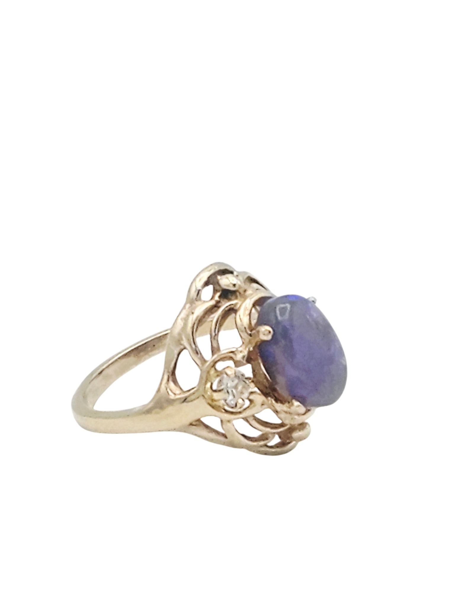 Opal, 14k Yellow Gold Ring: Centering an oval opal cabochon measuring approximately 10.26 x 7.0 mm, flanked by two round-cut white topaz, set in a 14k yellow gold ring mounting, size 6. Gross weight: 4.8 grams.