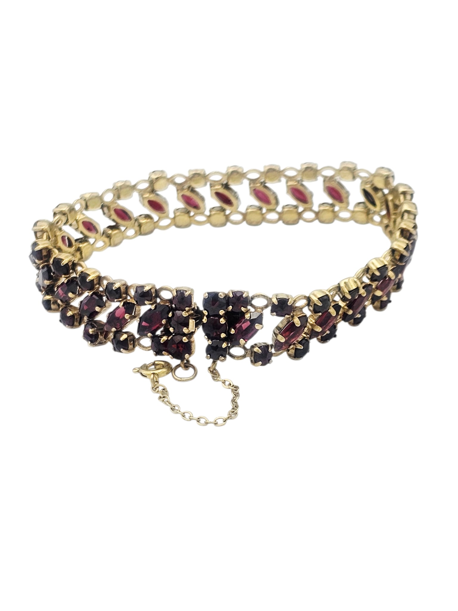 Garnet, Yellow Gold Bracelet: Featuring twenty-five marquise-cut and fifty-seven round-cut garnets weighing a total of approximately 19.30 ctw., set in an articulated, 8k yellow gold mounting, completed by a hidden