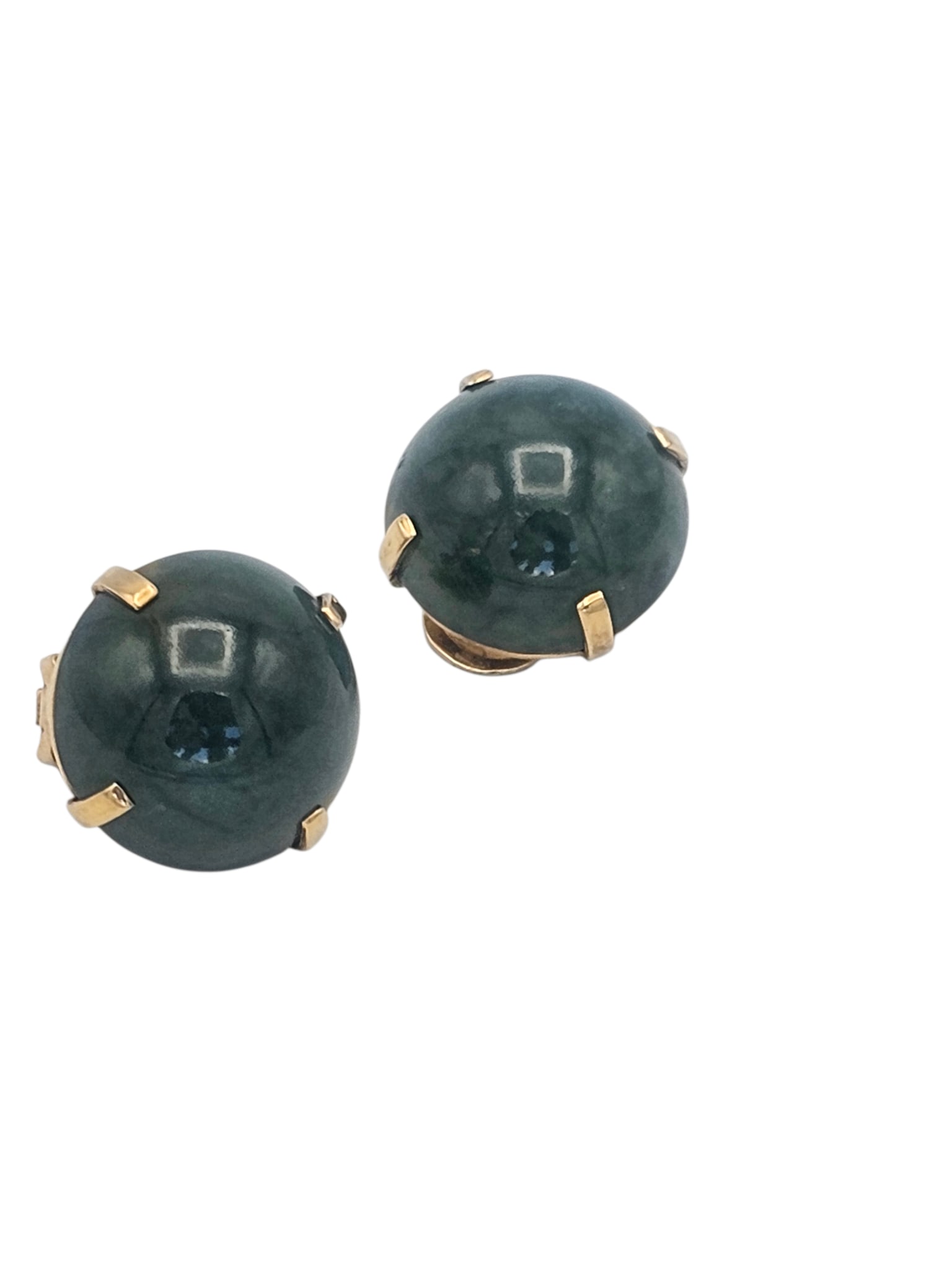 Pair of Agate, 14k Yellow Gold Ear Clips: Each featuring a round agate cabochon measuring approximately 21.32 mm, set in a 14k yellow gold ear clip mounting. Gross weight: 24.0 grams.
