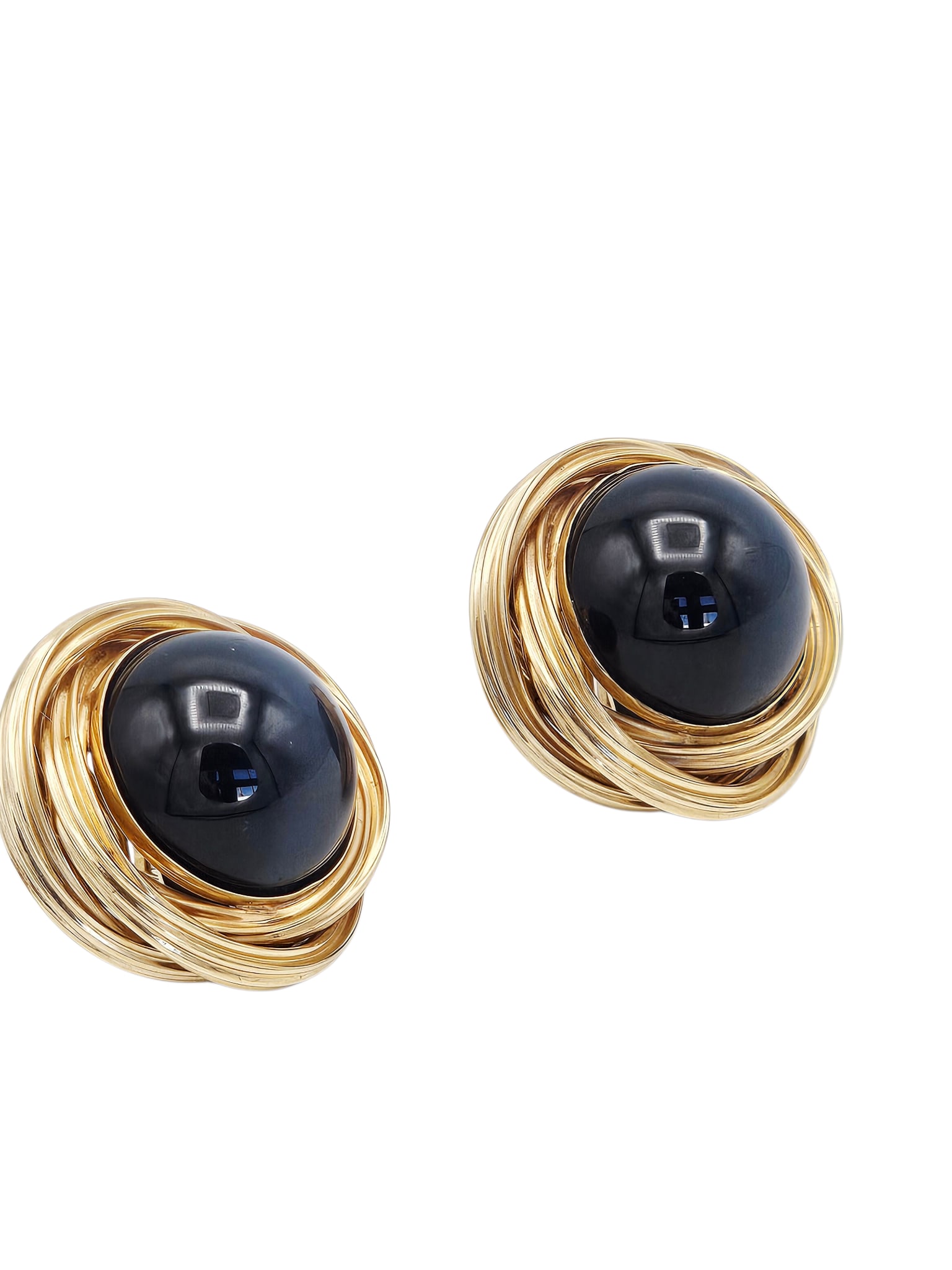 Pair of Onyx, 14k Yellow Gold Earrings: Each centering one round onyx cabochon measuring approximately 17.87 mm, set in a textured, 14k yellow gold earring mounting measuring approximately 1.05 inches in diameter. Gross weight: 21.7 grams.