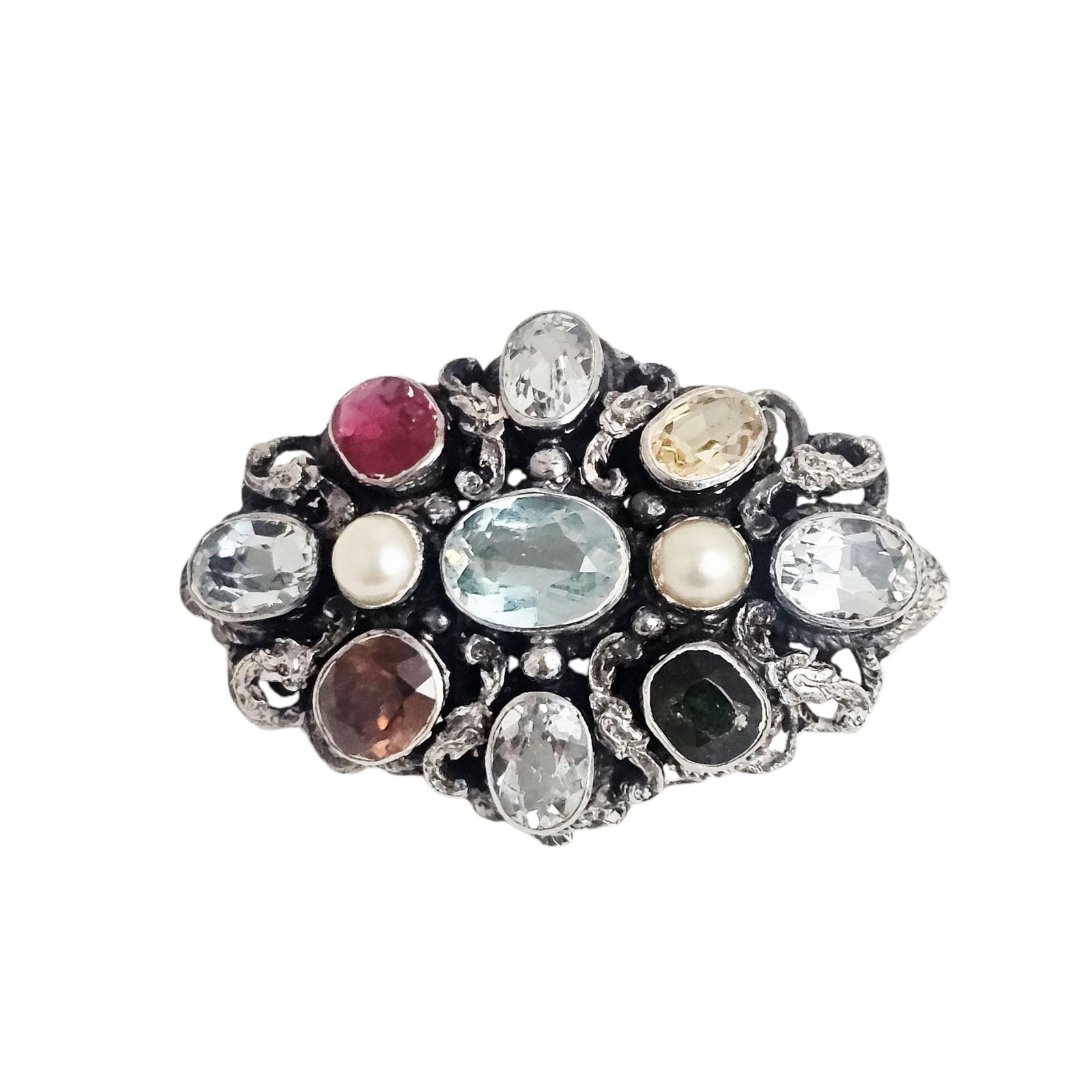 Multi-Stone, Sterling Silver Pin: Centering an oval-cut aquamarine weighing approximately 1.45 ct., accented by oval and cushion-shaped ruby, sapphire, quartz and zircon, further accented by two round cultured pearls, set in a