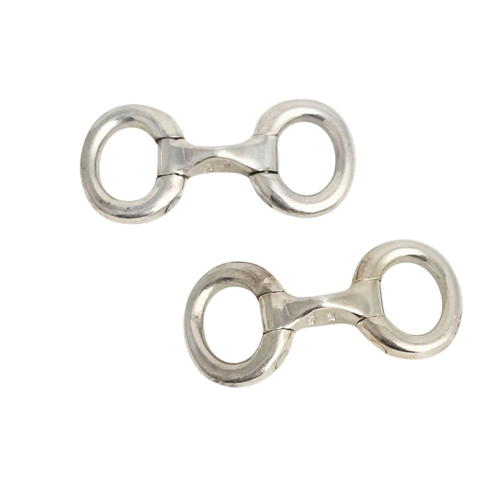 Sterling Stirrup Cufflinks: A robust pair of hinged cufflinks in the form of stirrups, laid flat and they fold upward for the wearer. Total weight 14.45 grams. Absence of a condition report does not indicate that this
