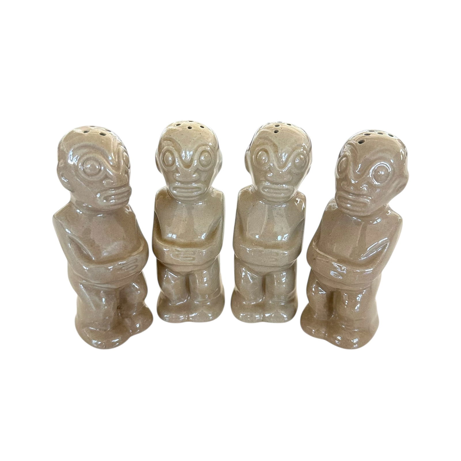 (Lot of 4) Trader Vic's Tiki Salt and Pepper Shakers: (Lot of) 4 Trader Vic's tiki salt and pepper shakers, each signed on the back.