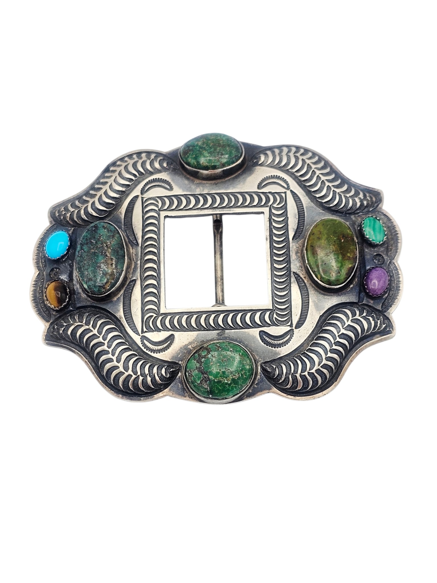 Navajo Multi-Stone, Sterling Silver Belt Buckle, Kirk Smith: Featuring eight oval cabochons, including turquoise, chrysocolla,, malachite, tiger's eye, and sugilite, set in a sterling silver buckle mounting measuring approximately 3.73 x 2.80 inches. Marked