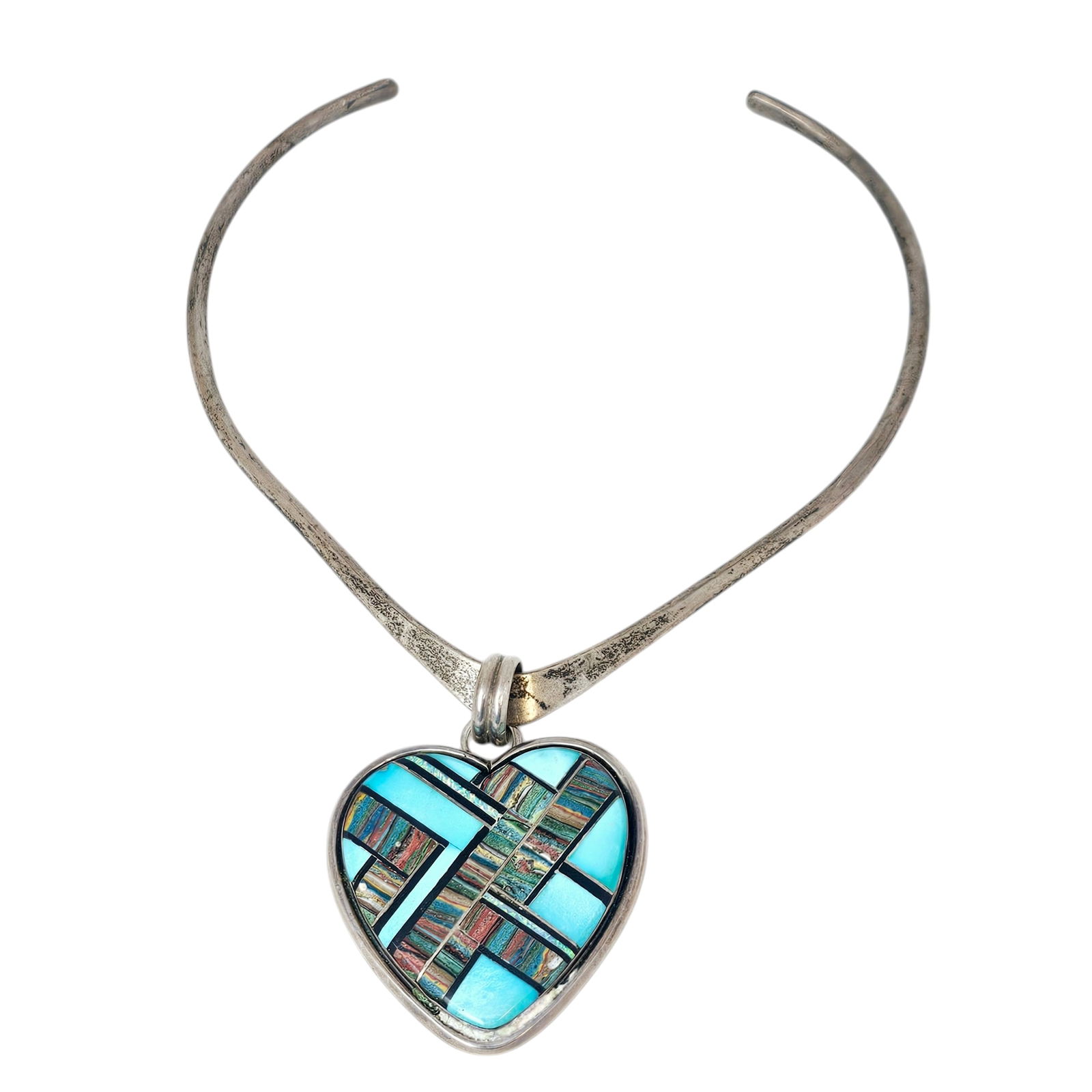 Multi-Stone, Sterling Silver Pendant, Robert Johnson: Designed as a heart, featuring inlaid turquoise, jet and calsilica, set in a sterling silver pendant measuring approximately 2.25 x 1.50 inches, suspended by a sterling silver 'V' shaped