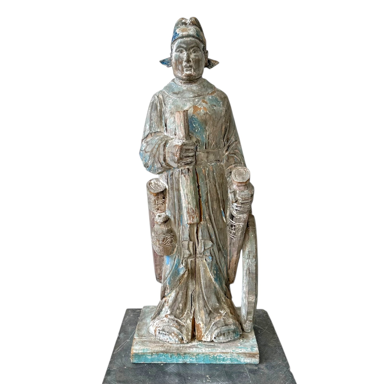 Large Carved Wood Figure of Asian Dignitary: Large wood carved sculpture of an Asian dignitary, with swords on either side of his hips, holding what appears to be a scroll, unsigned. Measures approximately 25 1/2 in H.