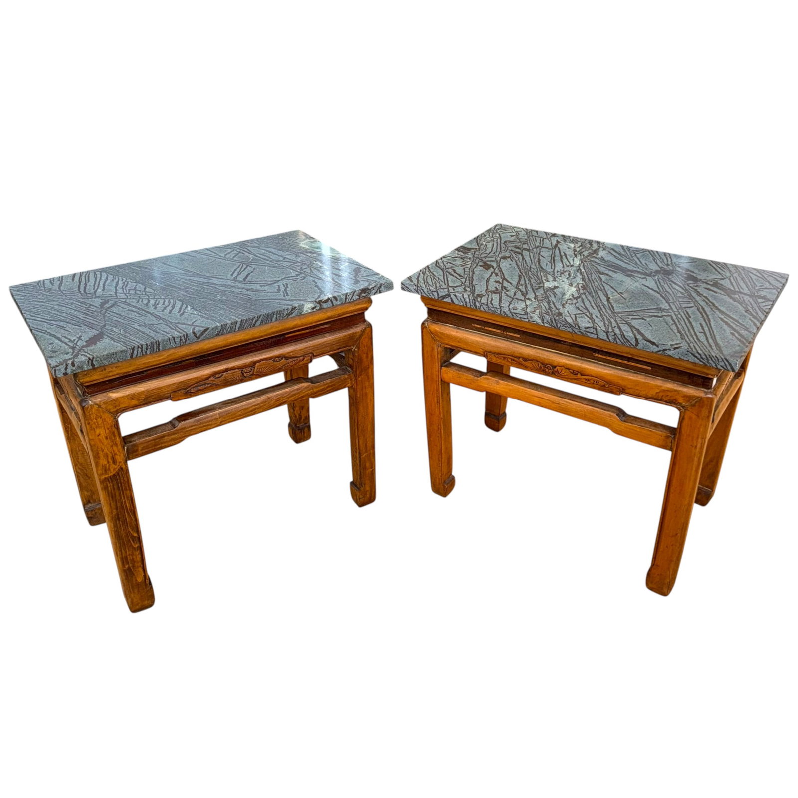 Pair of Carved Wood Asian -Style Side Tables: Pair of carved wood Asian-style side tables with stone tops, each table featuring a floral and foliate carved apron and hoof-style feet, double stretcher support, and later added green stone tops. Eac