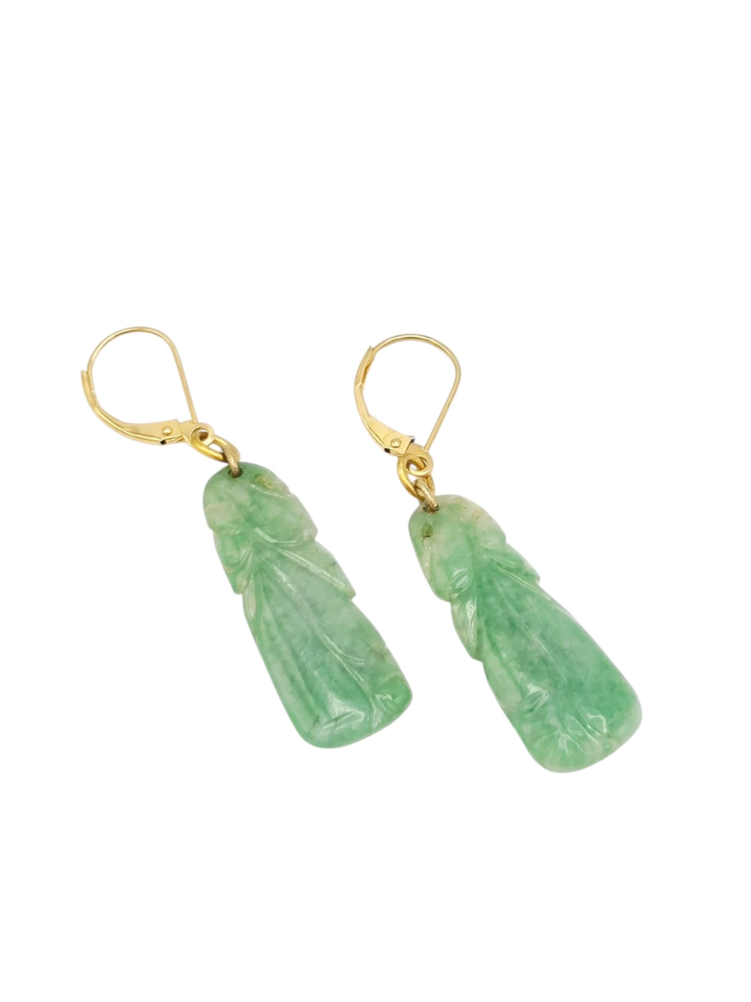 Pair of Jade, 14k Yellow Gold Earrings: Each featuring a carved jade plaque measuring approximately 1.5 inches (38.1 mm) in length, suspended by 14k yellow gold lever back earring mountings. Gross weight: 4.9 grams.