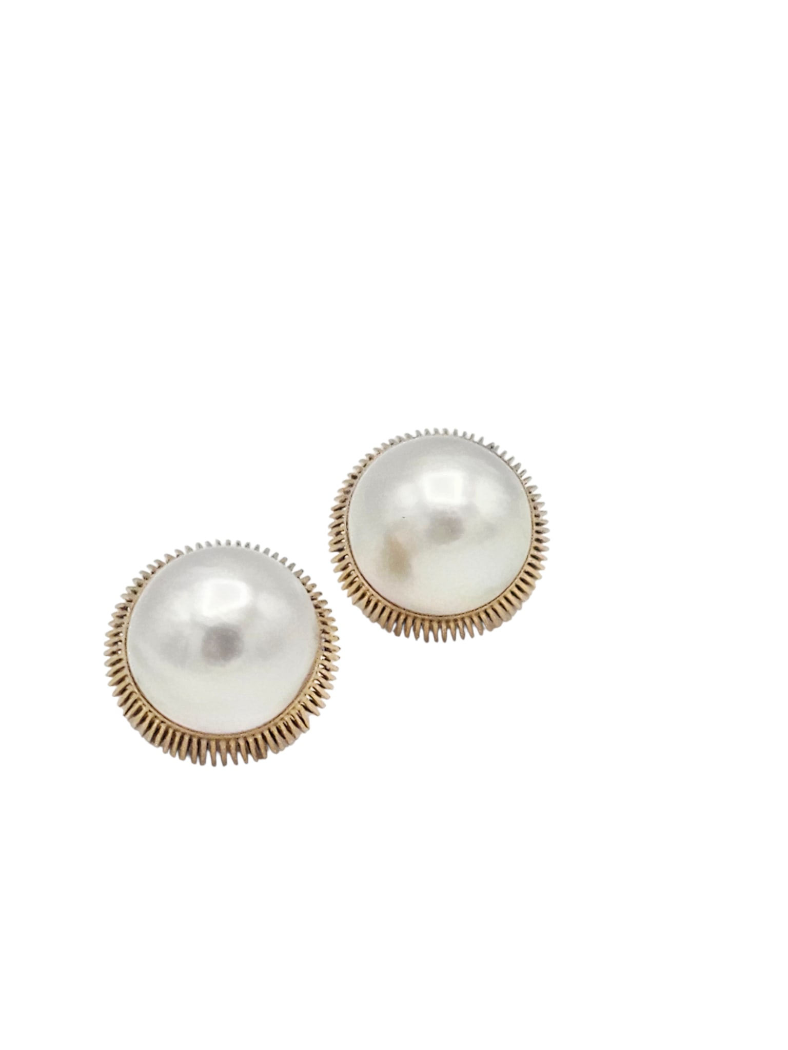 Pair of Mabe Pearl, 14k Yellow Gold Earrings: Each featuring a round mabe pearl set in a fluted, 14k yellow gold earring mounting measuring approximately 0.85 inches (22.0 mm). Gross weight: 16.0 grams. Note: marked 18k, tested to 14k.