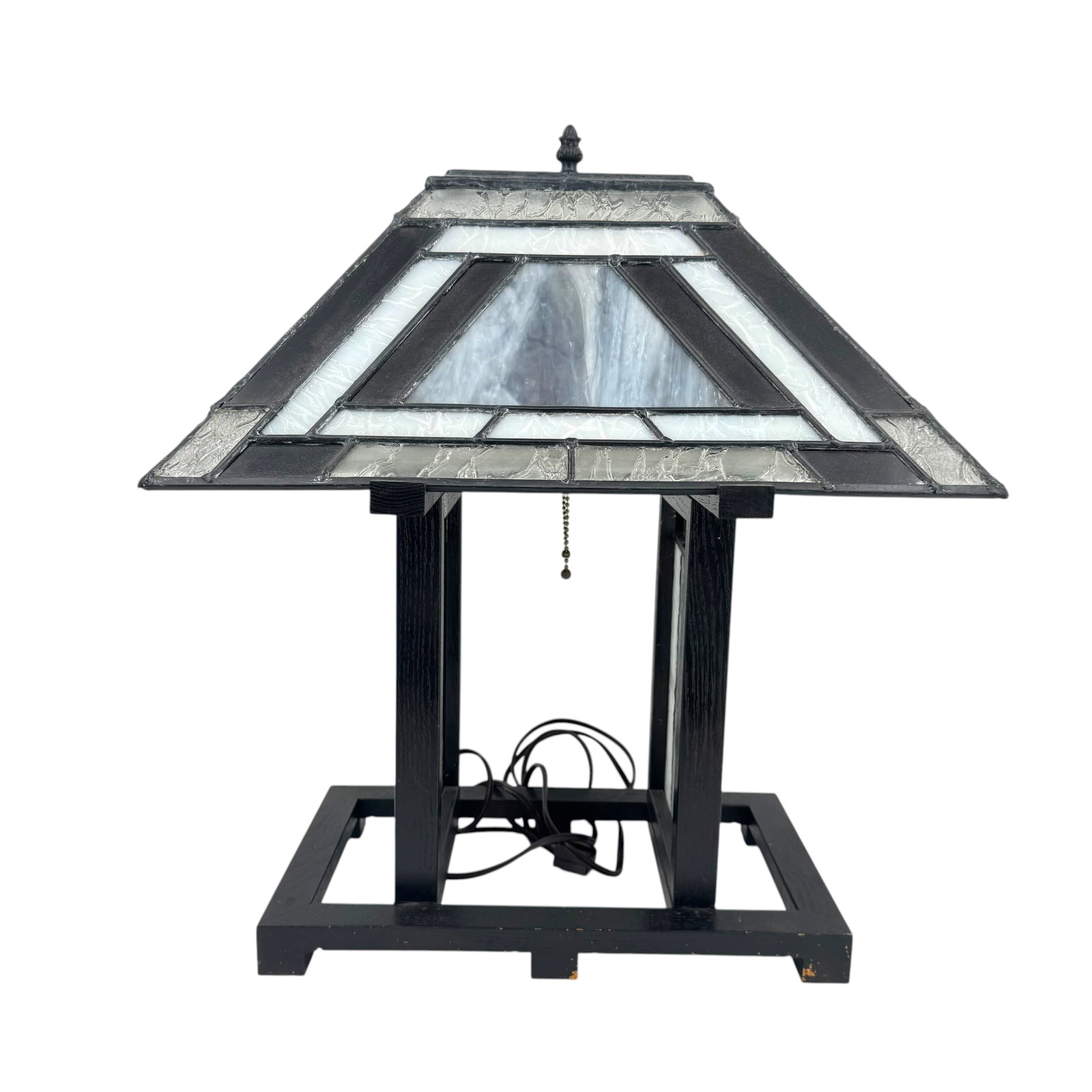 Mission-Style, Stained Glass Table Lamp: Mission-style stained glass table lamp in a pagoda shape with pyramid shade and 2 glass panels, in shades of white/gray/black, with dark wood frame, measures approximately 23 in H (includes finial) x 