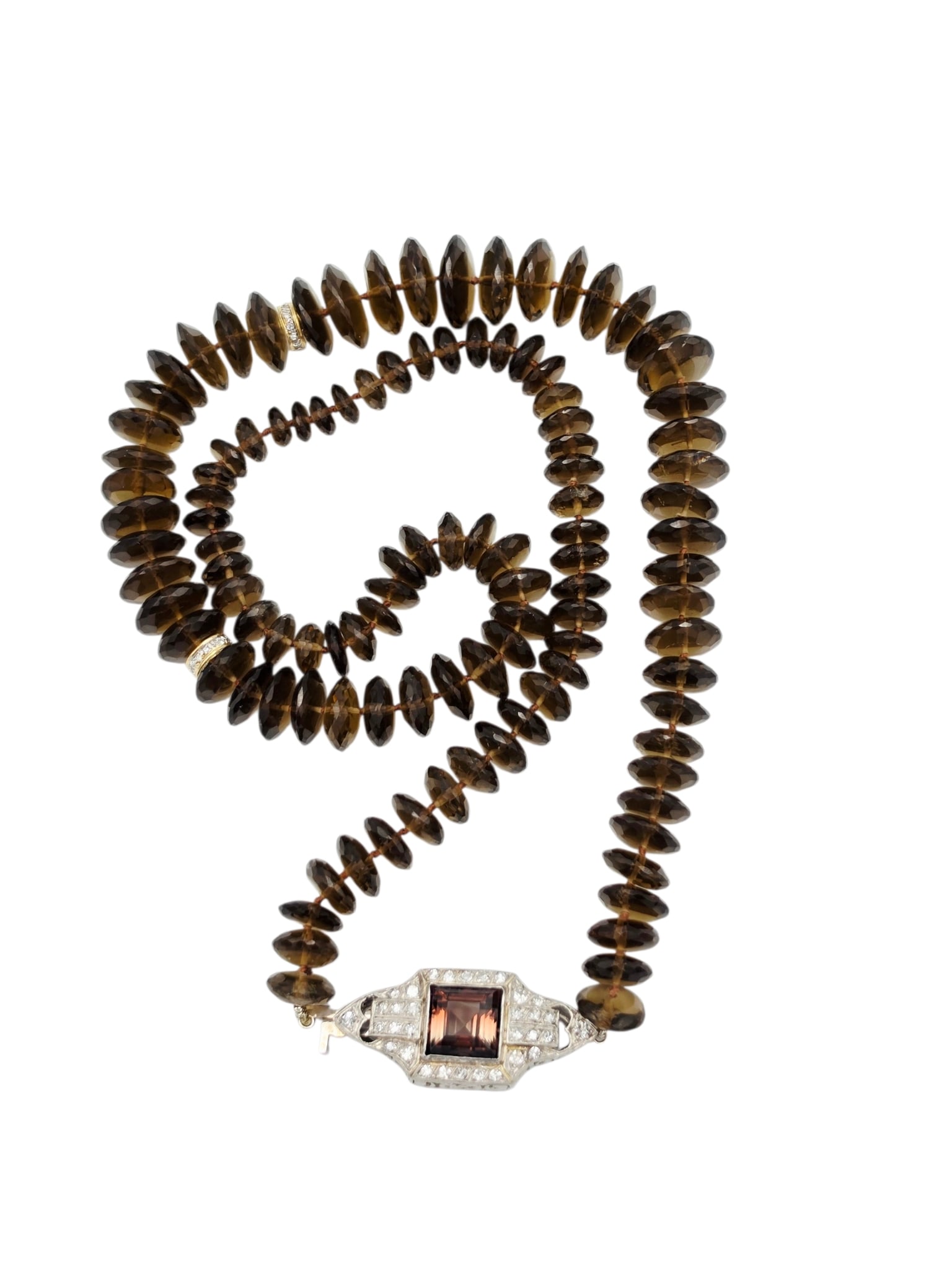 Diamond, Tourmaline, Smoky Quartz, Platinum Necklace: Composed of one hundred-eleven faceted smoky quartz beads measuring from approximately 13.3 to 6.5 mm, spaced by two diamond, yellow gold beads, completed by a diamond, platinum clasp centering one sq