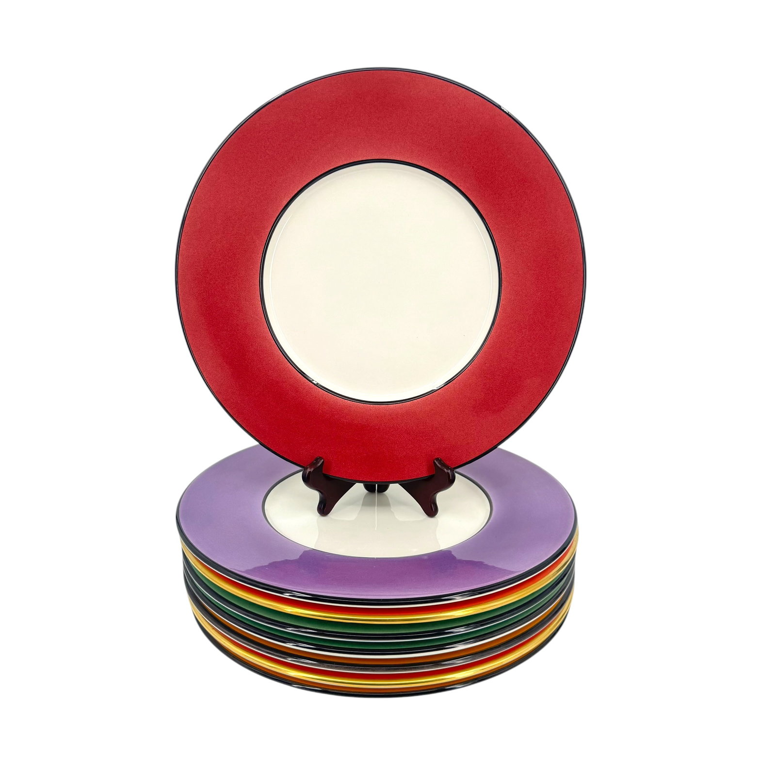 (Lot of) 8 Este Ceramiche "Fatto a Mano" Service Plates: (Lot of) 8 Este Ceramiche "Fatto a Mano" service plates in various colors, featuring a color block design, signed below, measures approximately 13 in D. Condition: one plate has a crack on t