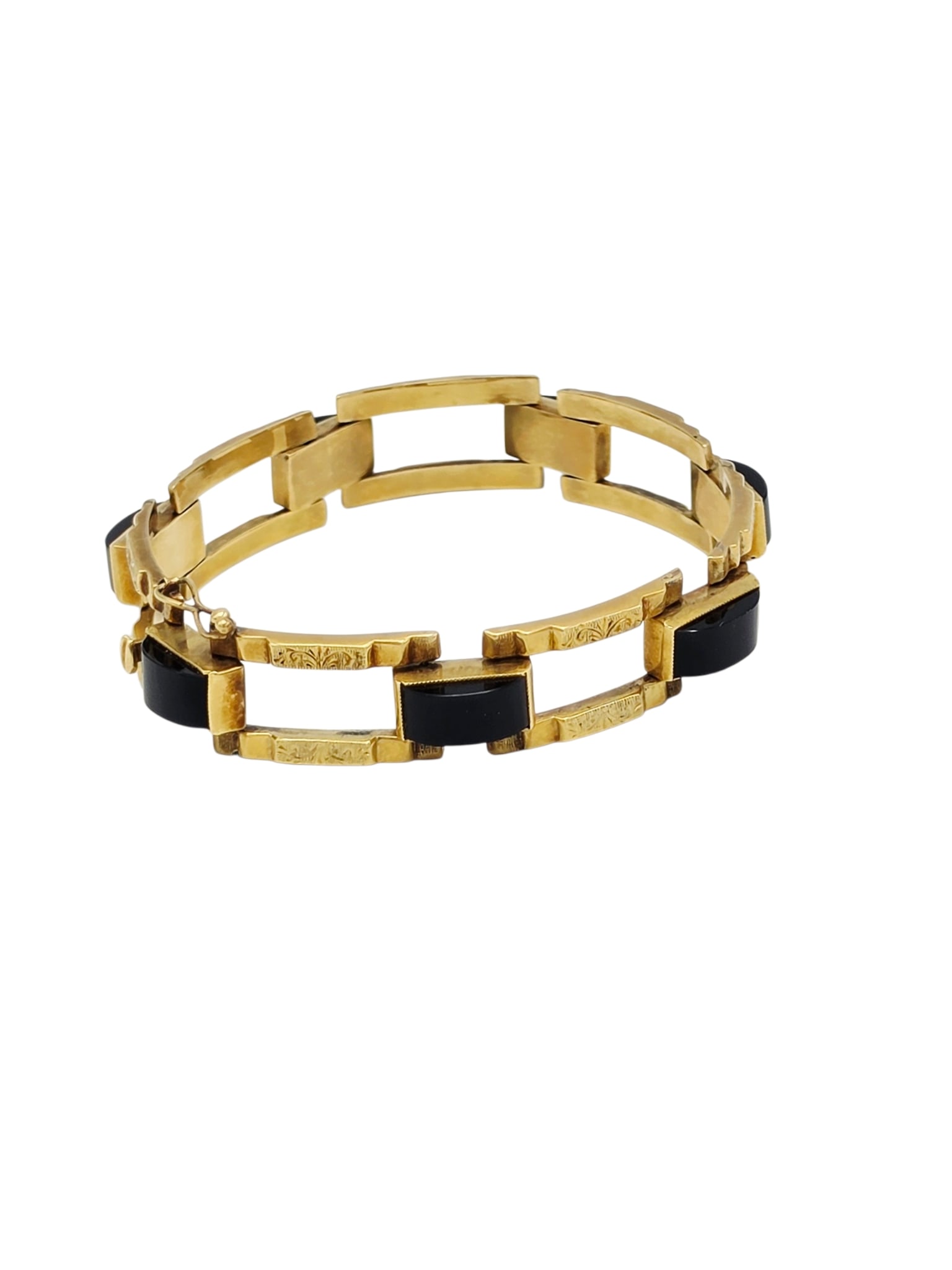 Art Deco Onyx, 14k Yellow Gold Bracelet: Designed as seven arched onyx cabochons joined to engraved, rectangular links, completed by a hidden box clasp with figure-eight safety, forming a 7 inch bracelet. With Austrian marks. Gross weight: