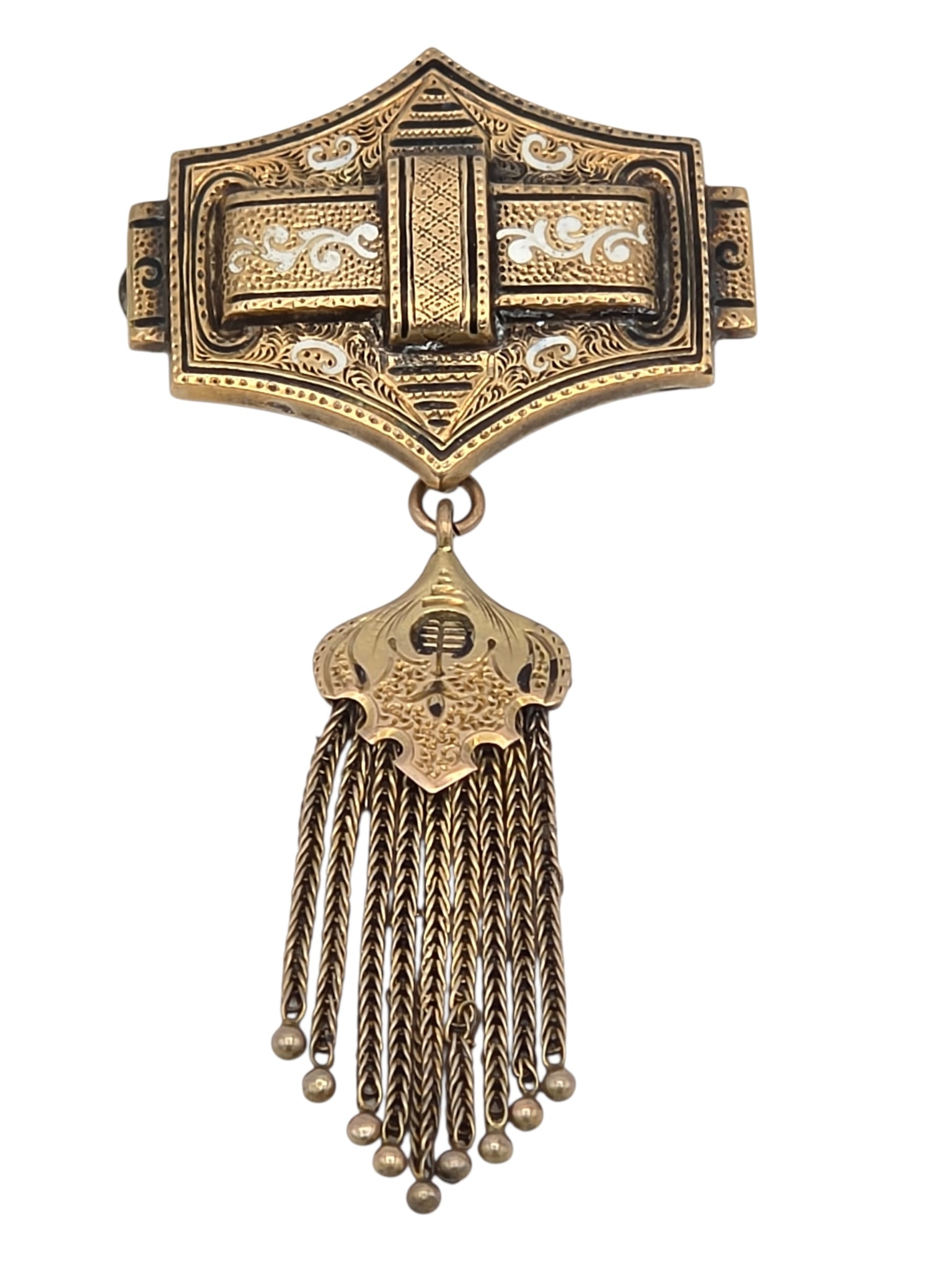 Victorian Enamel, 10k Yellow Gold Pin: The geometric-shape, textured pin accented by black and white enamel and suspending an articulated fringe, set in a 10k yellow gold mounting measuring approximately 2.75 x 1.40 inches. Gross weight: