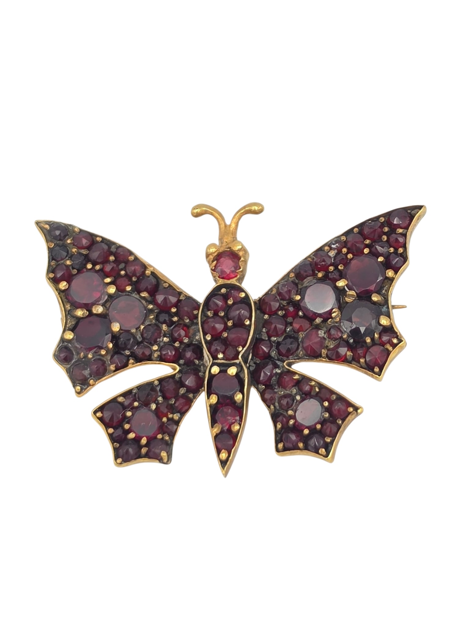 Bohemian Garnet, Gold-Filed Butterfly Pin: Designed as a butterfly, accented with numerous Bohemian garnets, set in a gold-filled pin mounting measuring approximately 1.50 x 1.10 inches. Gross weight: 6.0 grams. Item condition: original clasp