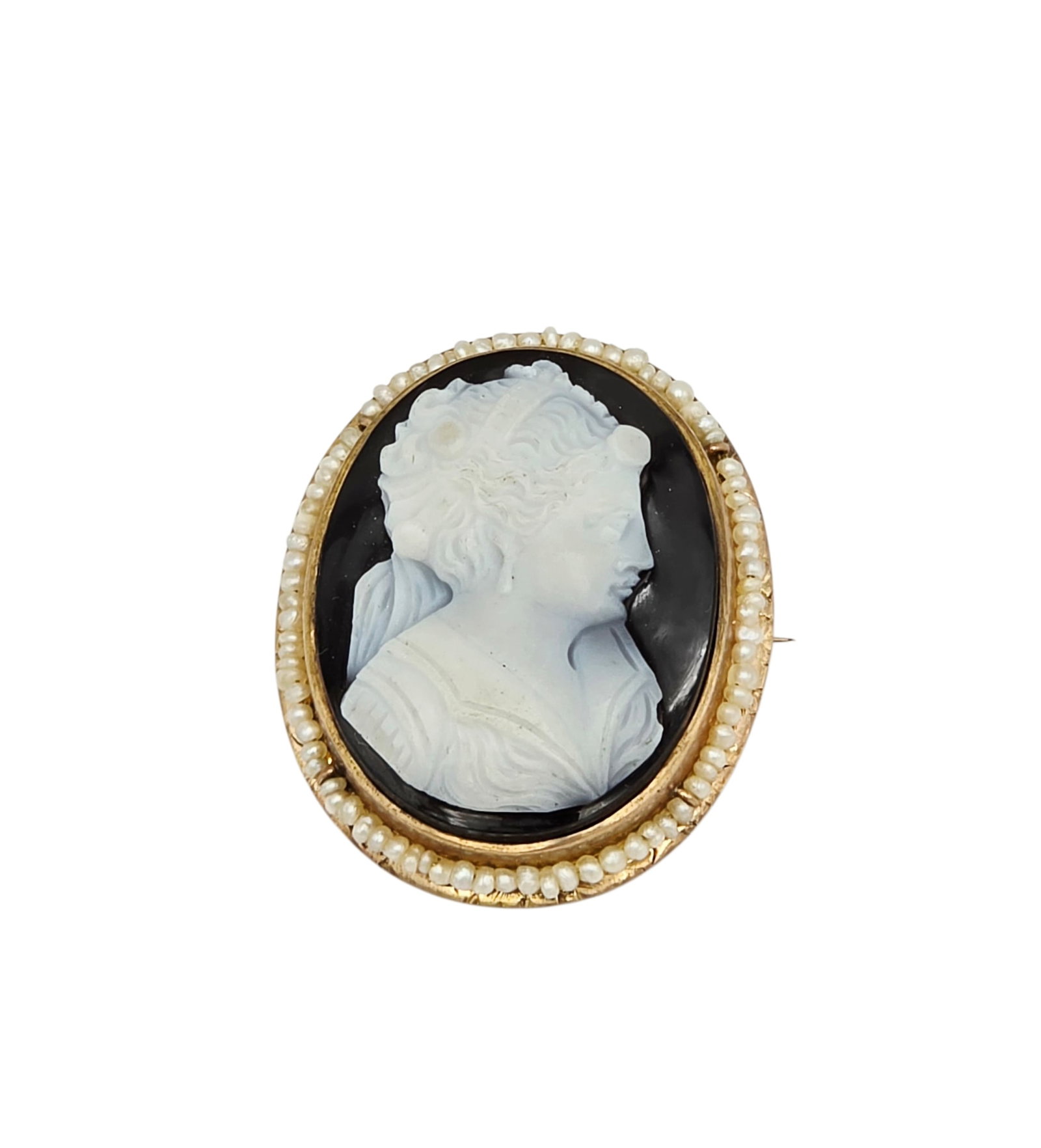 Antique Hardstone Cameo, Seed Pearl, 14k Pin Pendant: Featuring an oval hardstone cameo of a classical beauty in profile, surmounted by seed pearls, set in a 14k yellow gold pin pendant mounting measuring approximately 1.30 x 1.07 inches. Gross weight:
