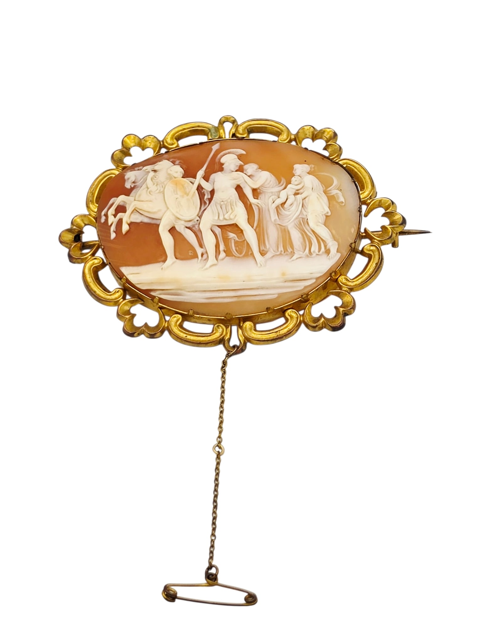 Shell Cameo, 14k Yellow Gold Brooch: Centering an oval shell cameo carved to depict Adromache beseeching Hector to remain behind the rampart at the walls of Troy, set in a scalloped, 14k yellow gold pin mounting measuring approximat