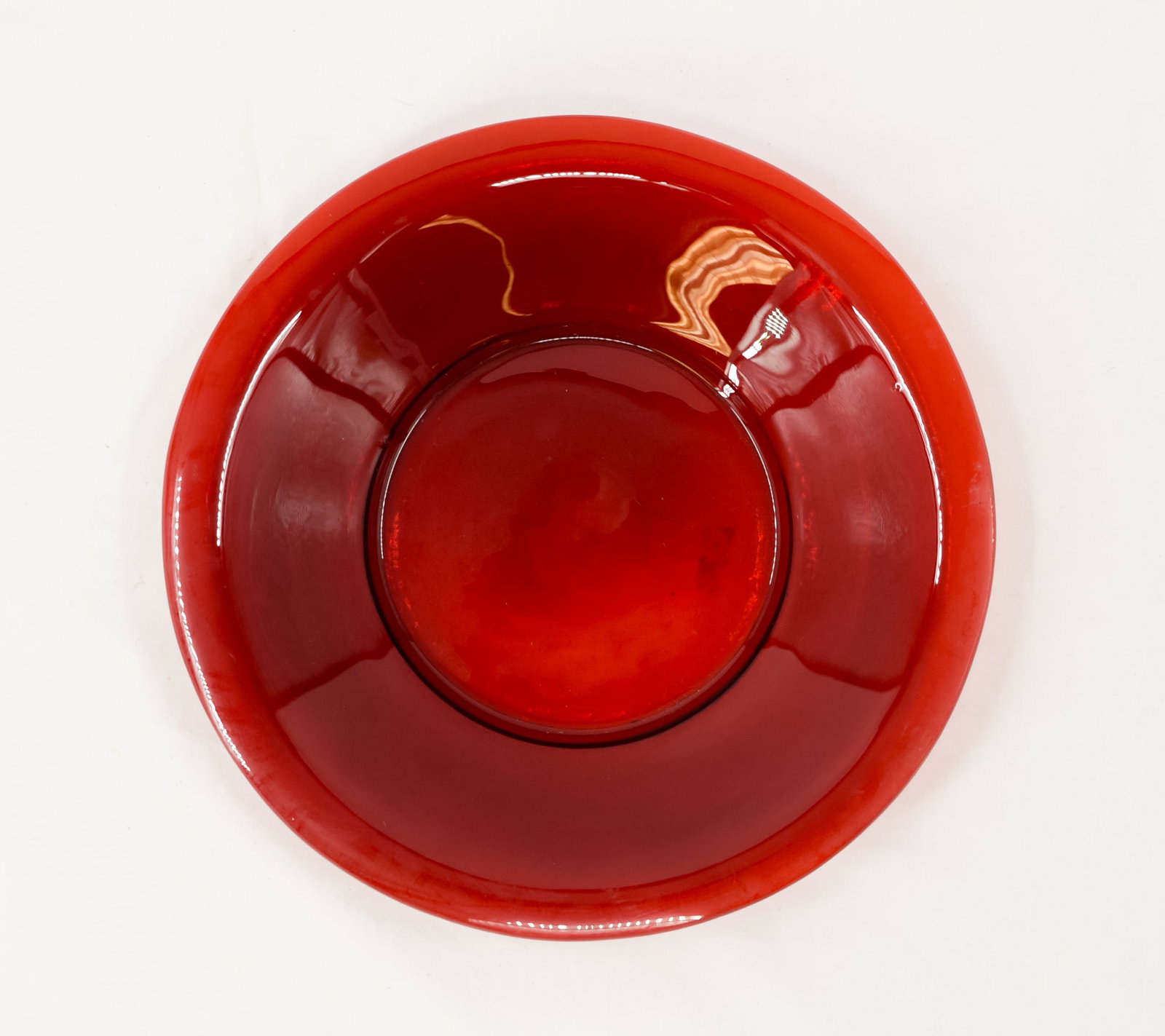 A Red Glass Dish, China, 19th/20th Century or Later: A red glass dish, China, 19th /20th century or later, possibly Peking glass, signed on bottom. Absence of a condition report does not indicate that this lot is in perfect condition. Please request a