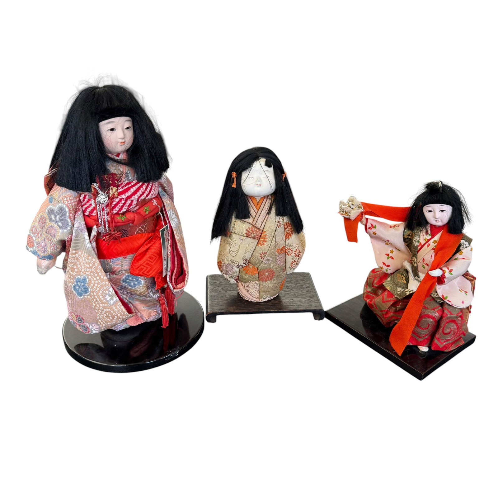 (Lot of) 3 Vintage Japanese Ichimatsu Child Dolls: (Lot of) 3 vintage Japanese Ichimatsu child dolls, mid to late 20th century, each featuring traditional dress, blunt cut bangs, and youthful features.
