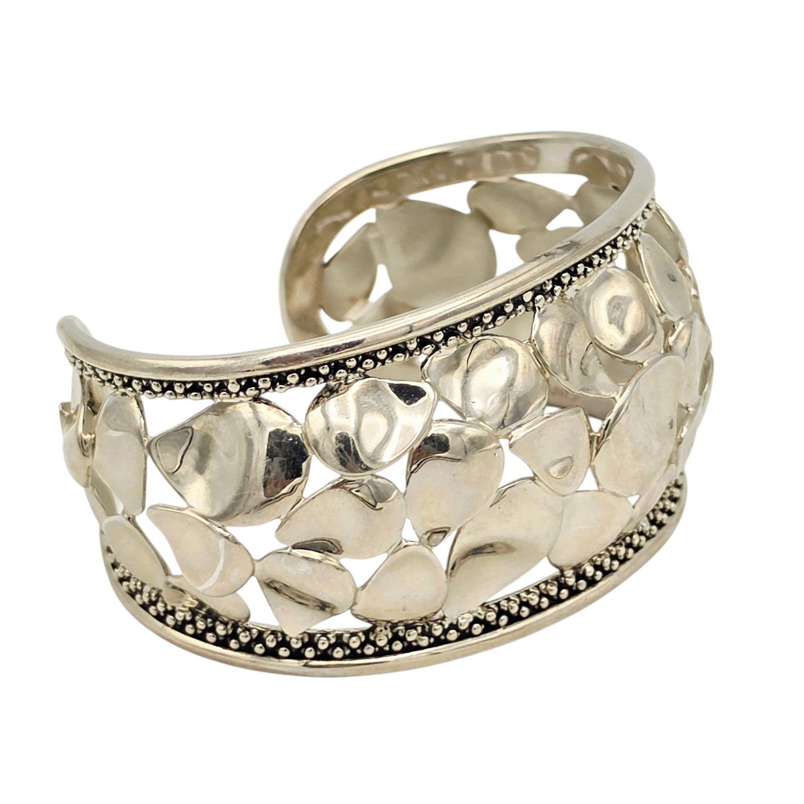 Sterling Silver Cuff Bracelet, Michael Dawkins: The textured sterling silver cuff measuring approximately 1.50 inches in width, fitting to an inner circumference of 7 1/2 inches, 1.05 inch gap. Signed: 'Michael Dawkins.' Gross weight: 58.6 
