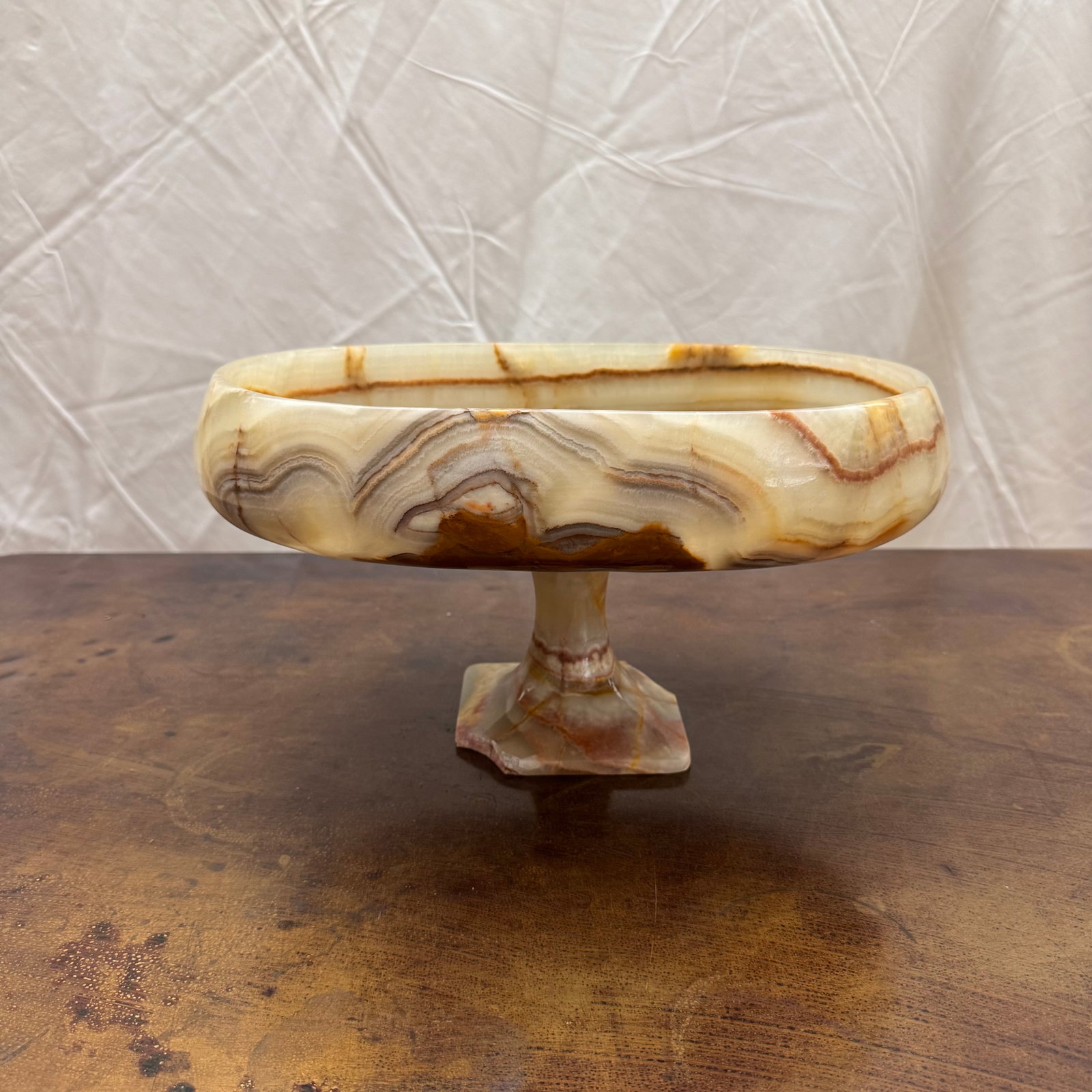 Oval Banded Onyx Stone Tazza Bowl: Mid-century oval banded onyx stone tazza on pedestal base. Condition: there are chips to the base.