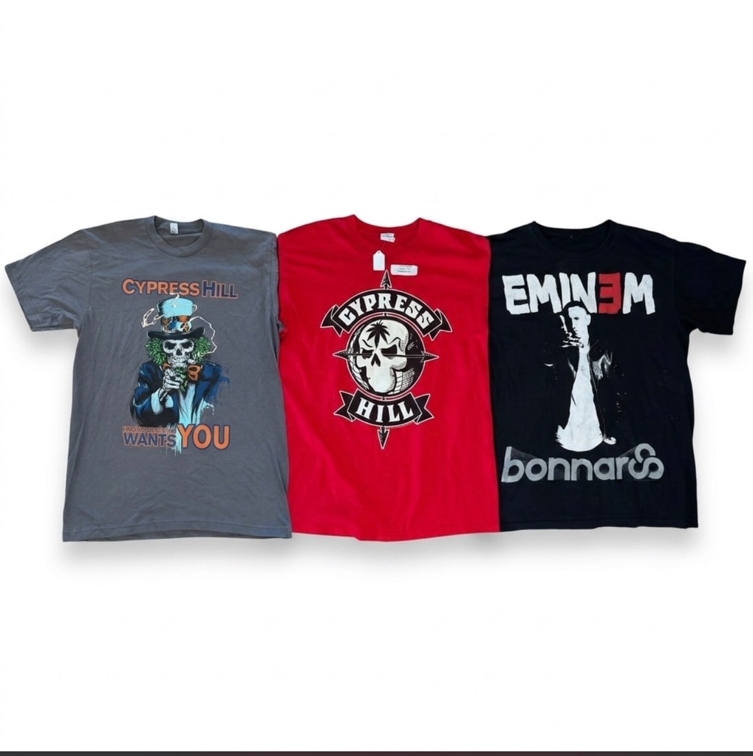 (Lot of) 3: Two Cypress Hill and one Eminem concert tees: (Lot of) 3 vintage tees: 2 Cypress Hill and 1 Eminem concert tees. Sizes will be updated soon. Condition: wear and tear consistent with age and use.