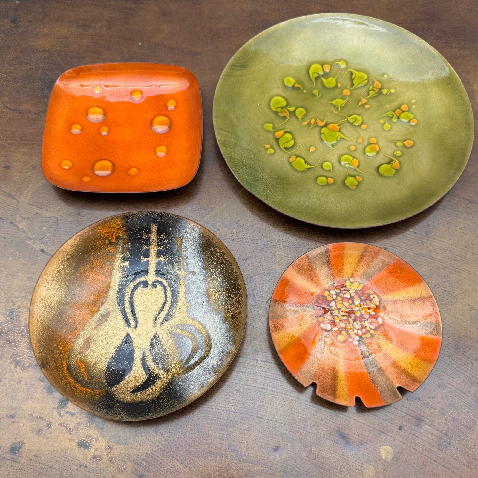 (Lot of) 4 Mid-Century Enamel on Copper Dishes, incl Bovano: (Lot of) 4 mid-century enamel on copper dishes, including one from Bovano of Cheshire CT and one signed Bette. Each featuring a unique design in oranges and chartreuse.